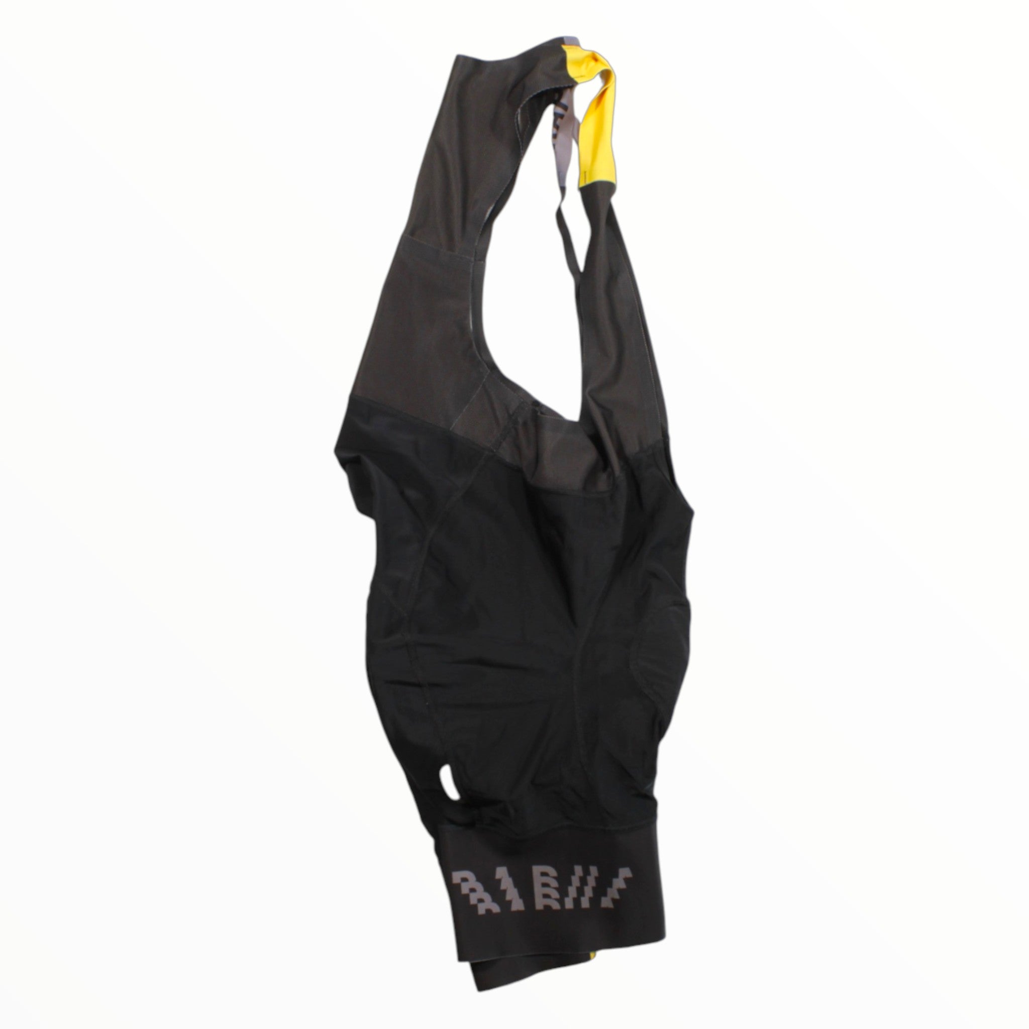 Men's cycling bib shorts, black with yellow strap accents and Rapha logo on leg.