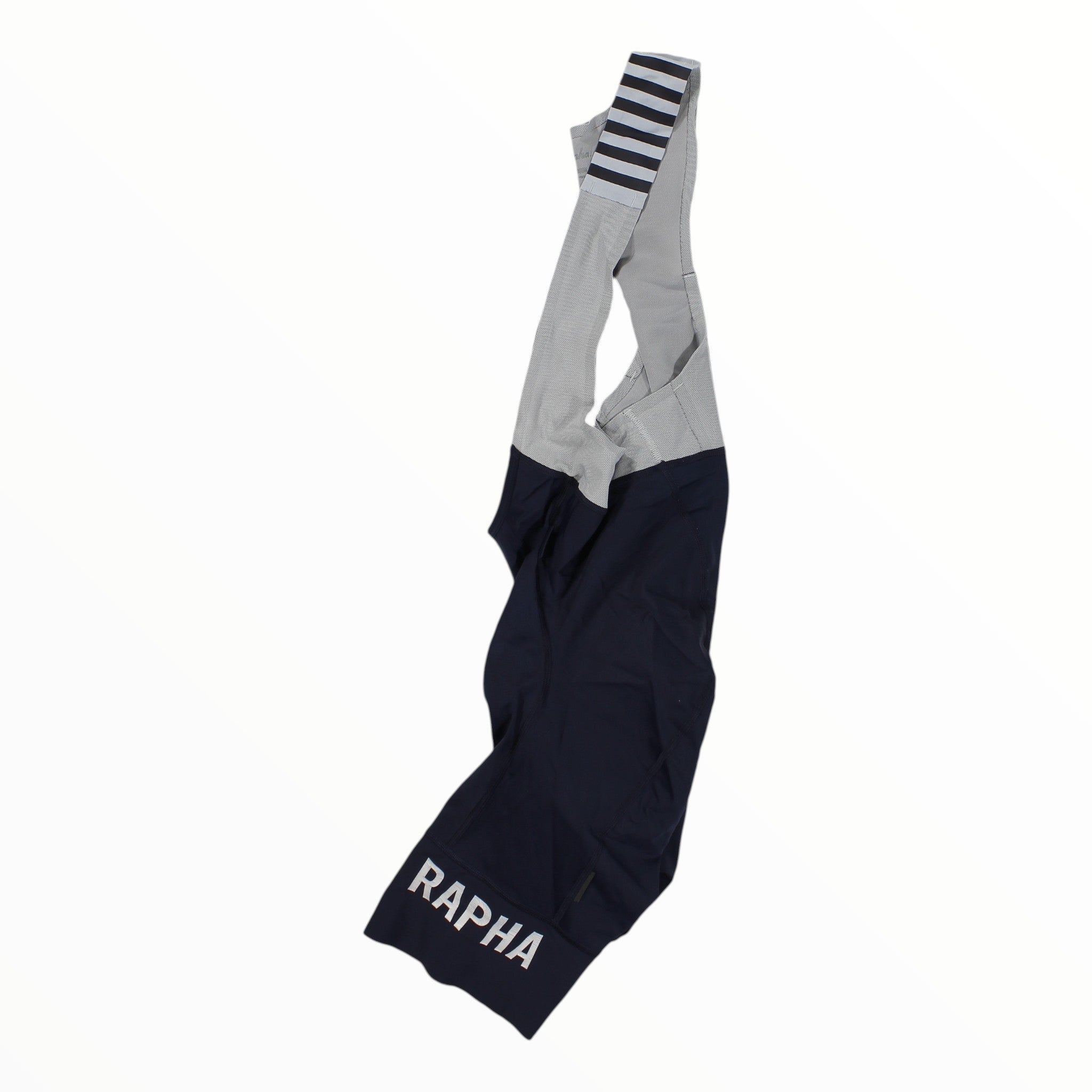Rapha Pro Team bib shorts with gray upper and navy lower panels, striped cuff, RAPHA print