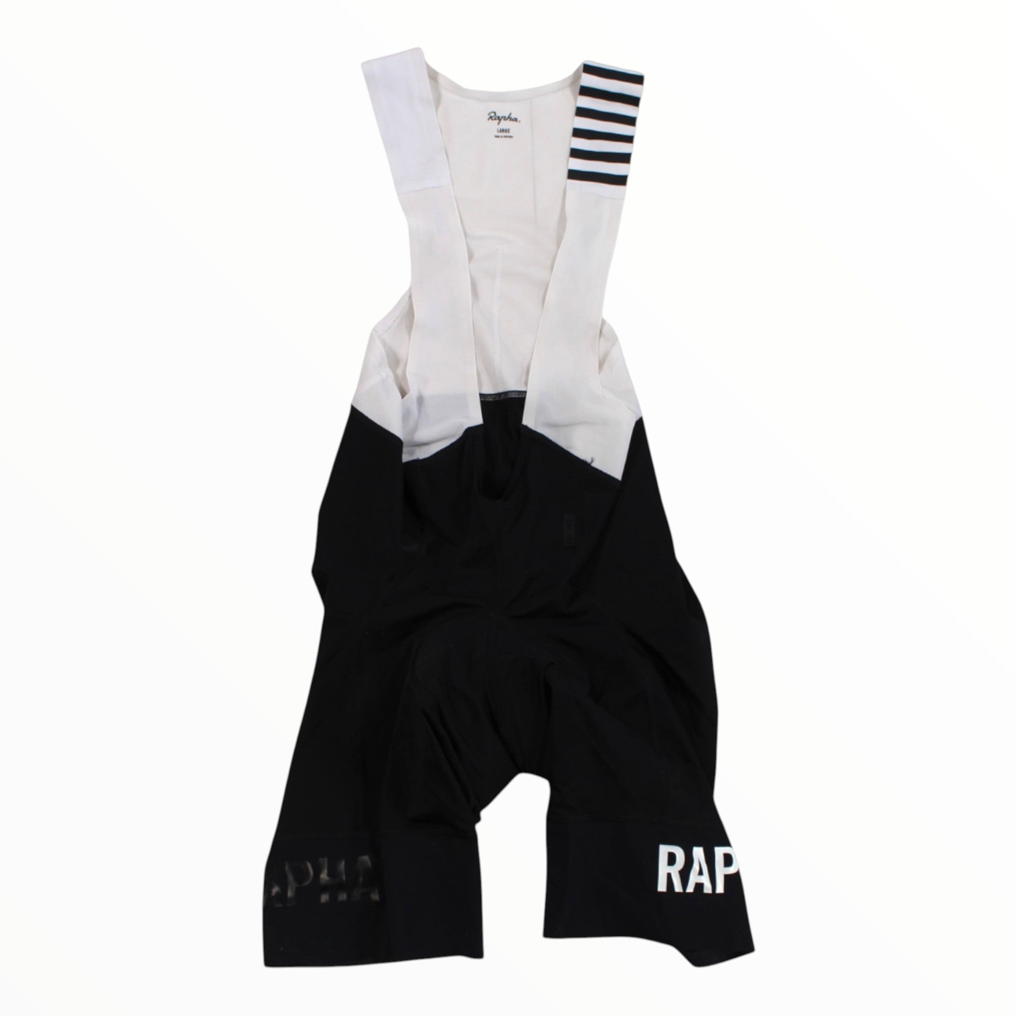 Rapha Pro Team bib shorts with white top, black lower, striped leg cuffs, side padding panels