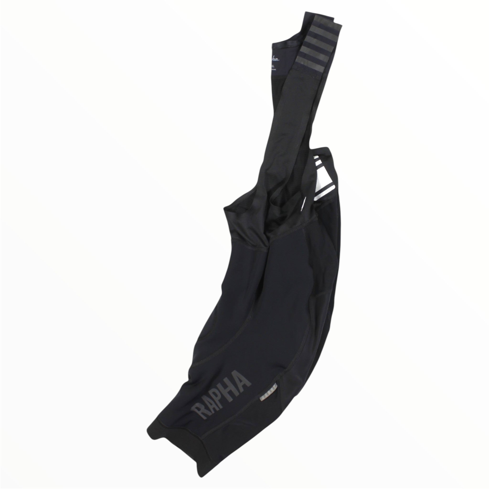The Rapha Mens Pro Team Winter Bib Shorts in black, featuring shoulder straps and RAPHA branding on one leg, are displayed against a plain white background, showcasing sleek, form-fitting fabric designed for elite men's cycling.