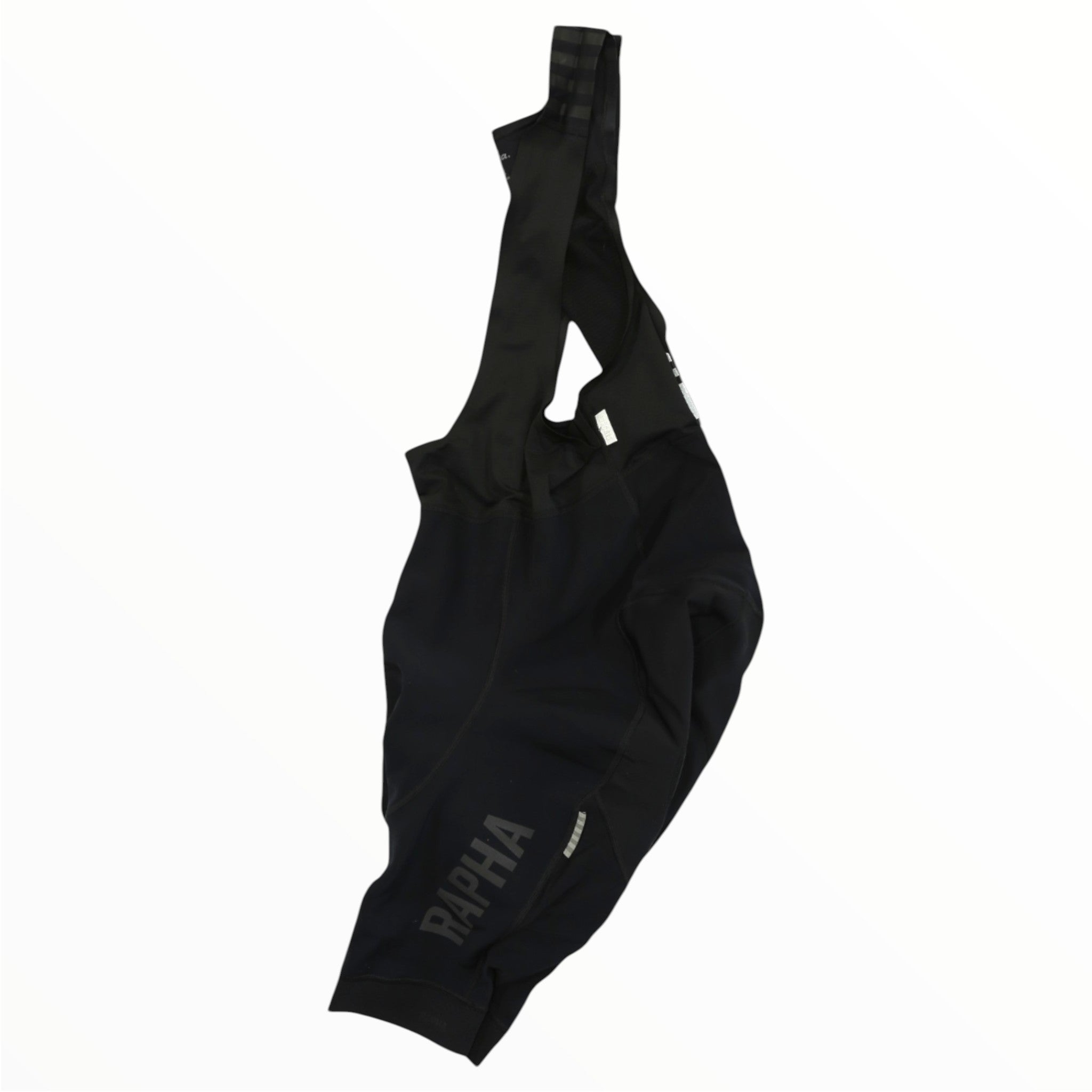 The Rapha Mens Pro Team Winter Bib Shorts, designed for men's cycling, are displayed against a white background with RAPHA in large letters on one leg.