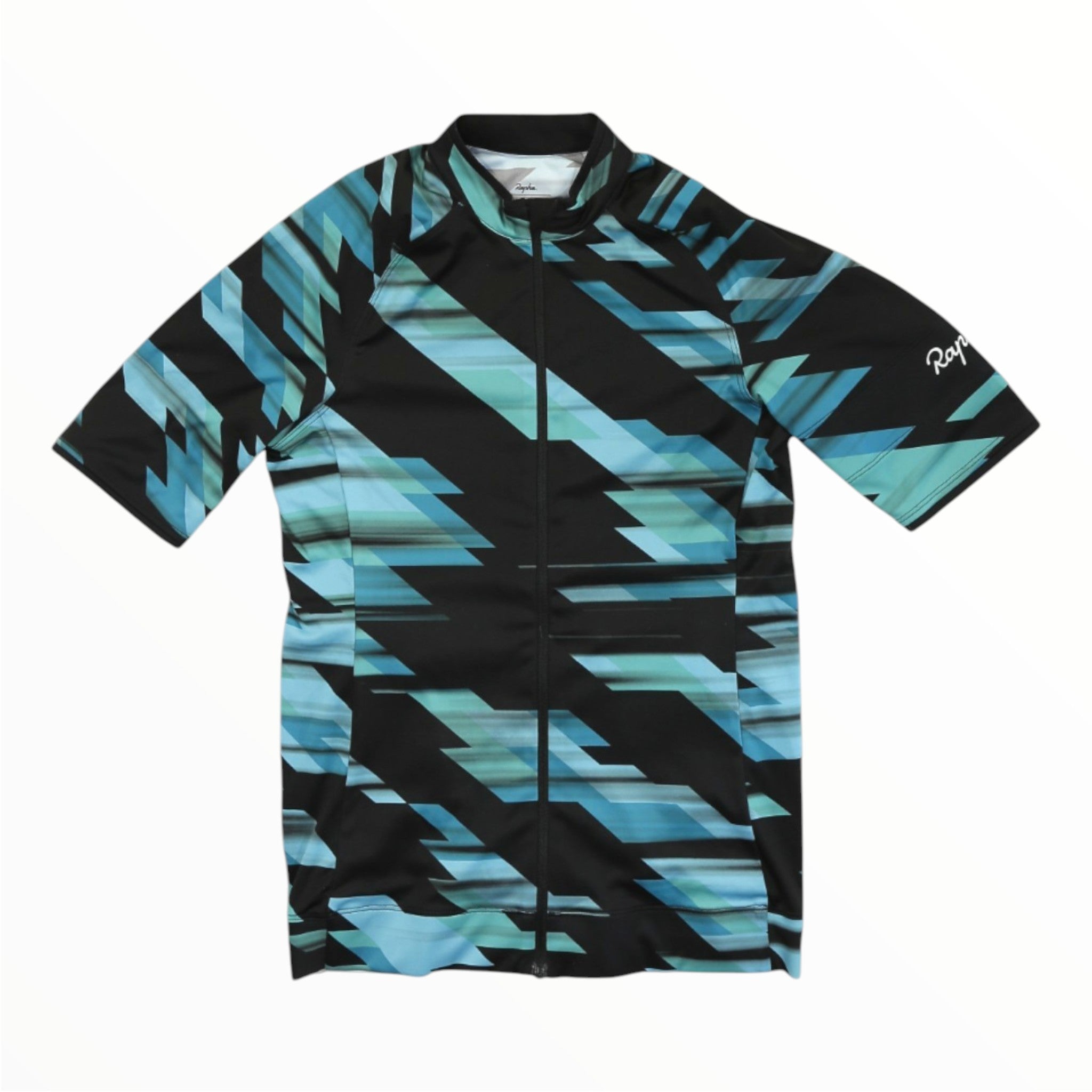 The Rapha Mens Core Jersey is a short-sleeve men’s cycling jersey featuring a black base with striking angular blue, teal, and turquoise zigzag patterns. Designed for performance and style, it includes a front zipper and displays the Rapha branding on the left sleeve.