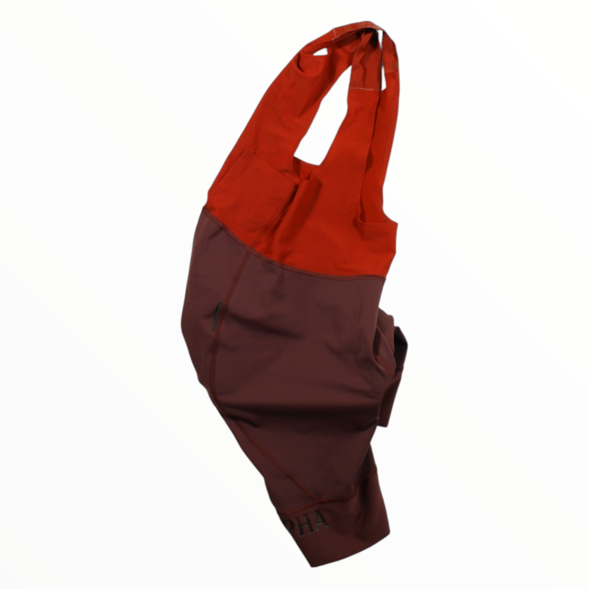 Men's cycling bib shorts with orange upper panel and maroon lower legs, Rapha logo.