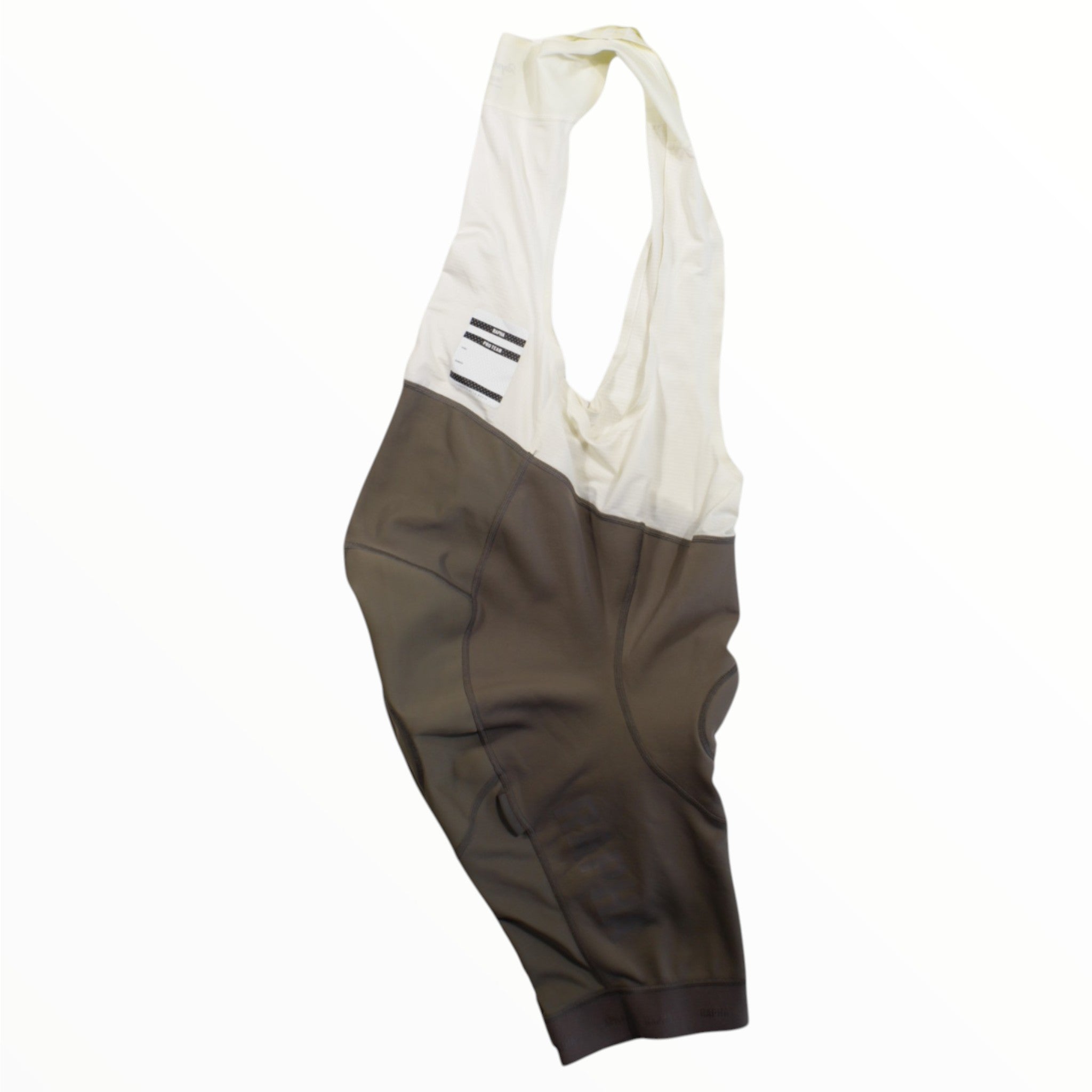 The Rapha Mens Pro Team Winter Bib Shorts feature white shoulder straps and a brownish-gray lower section, shown against a plain white background—ideal for upgrading your men's cycling apparel collection.
