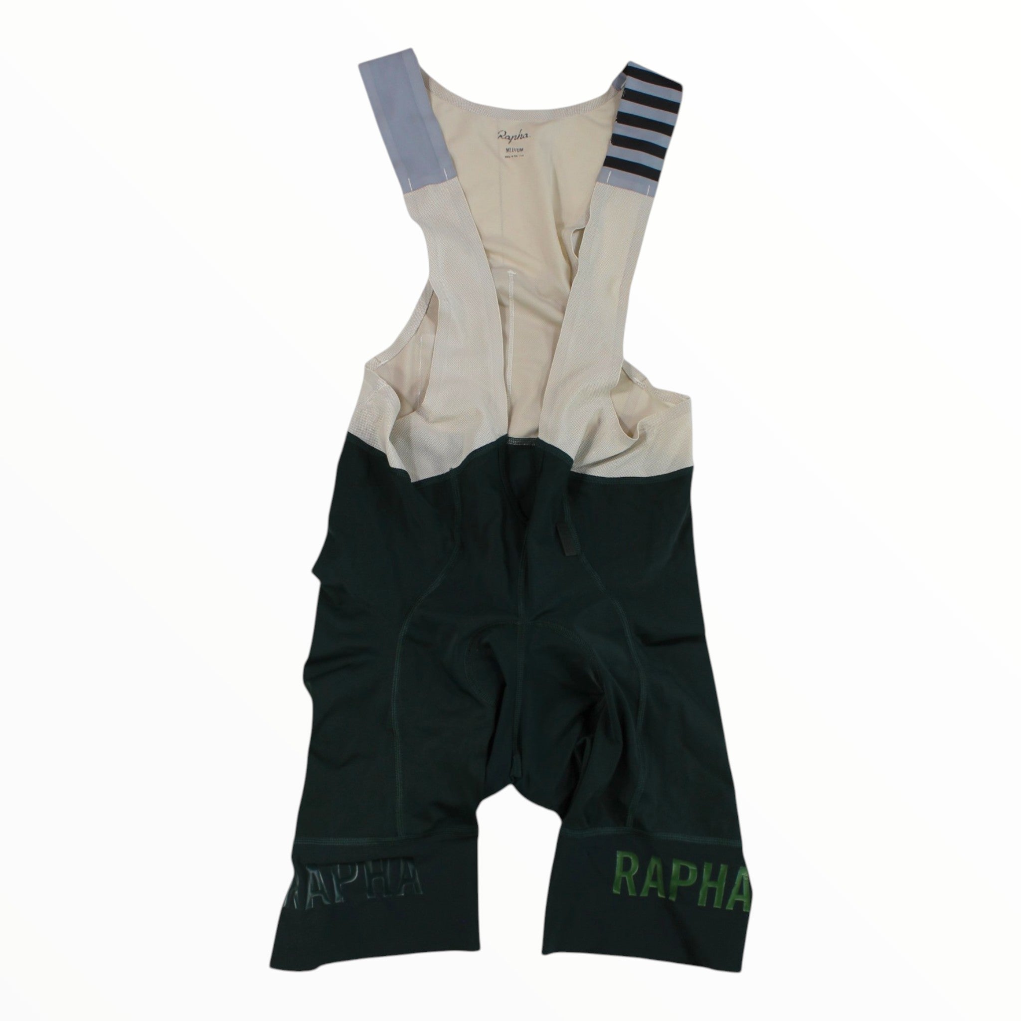 Rapha Pro Team bib shorts with light cream upper, dark green lower, striped cuffs, RAPHA logo