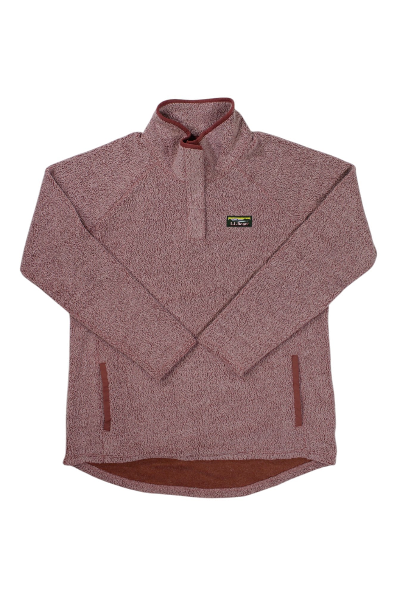 The L.L.Bean Women's Tumbled Sherpa 1/4 Snap Pullover features a mauve textured fabric, high collar, long sleeves, kangaroo and front pockets, a chest logo patch, and a hem that's slightly longer in the back.