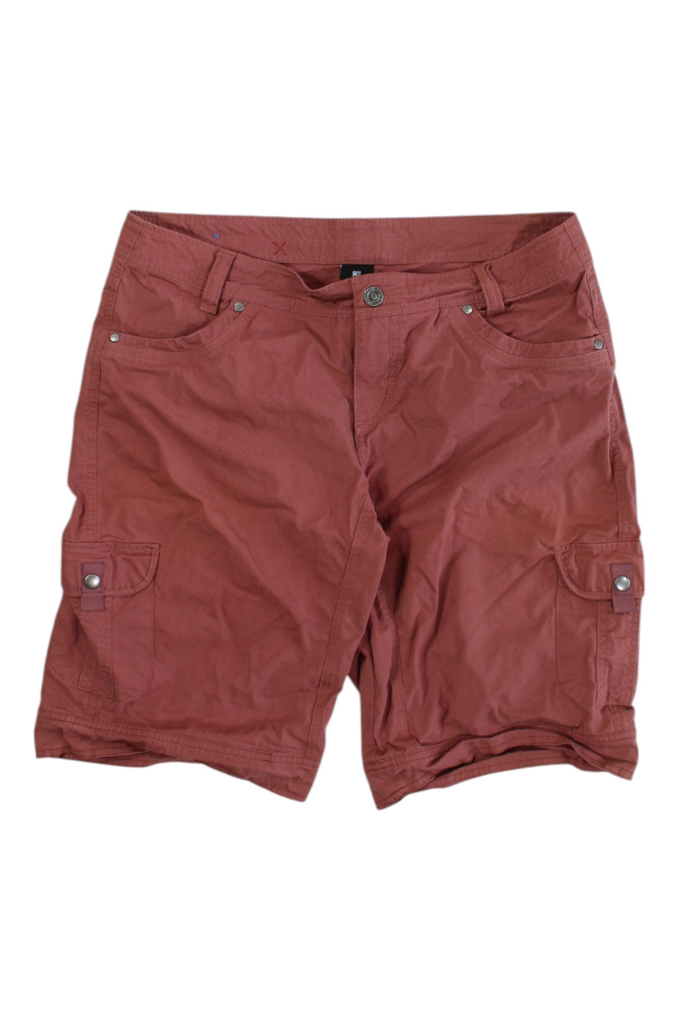 A pair of KUHL Women's Splash 11 Shorts in reddish-brown with side pockets, button and zip closure, belt loops, and made from a performance cotton blend fabric, shown on a white background.