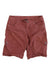 A pair of KUHL Women's Splash 11 Shorts in reddish-brown with side pockets, button and zip closure, belt loops, and made from a performance cotton blend fabric, shown on a white background.