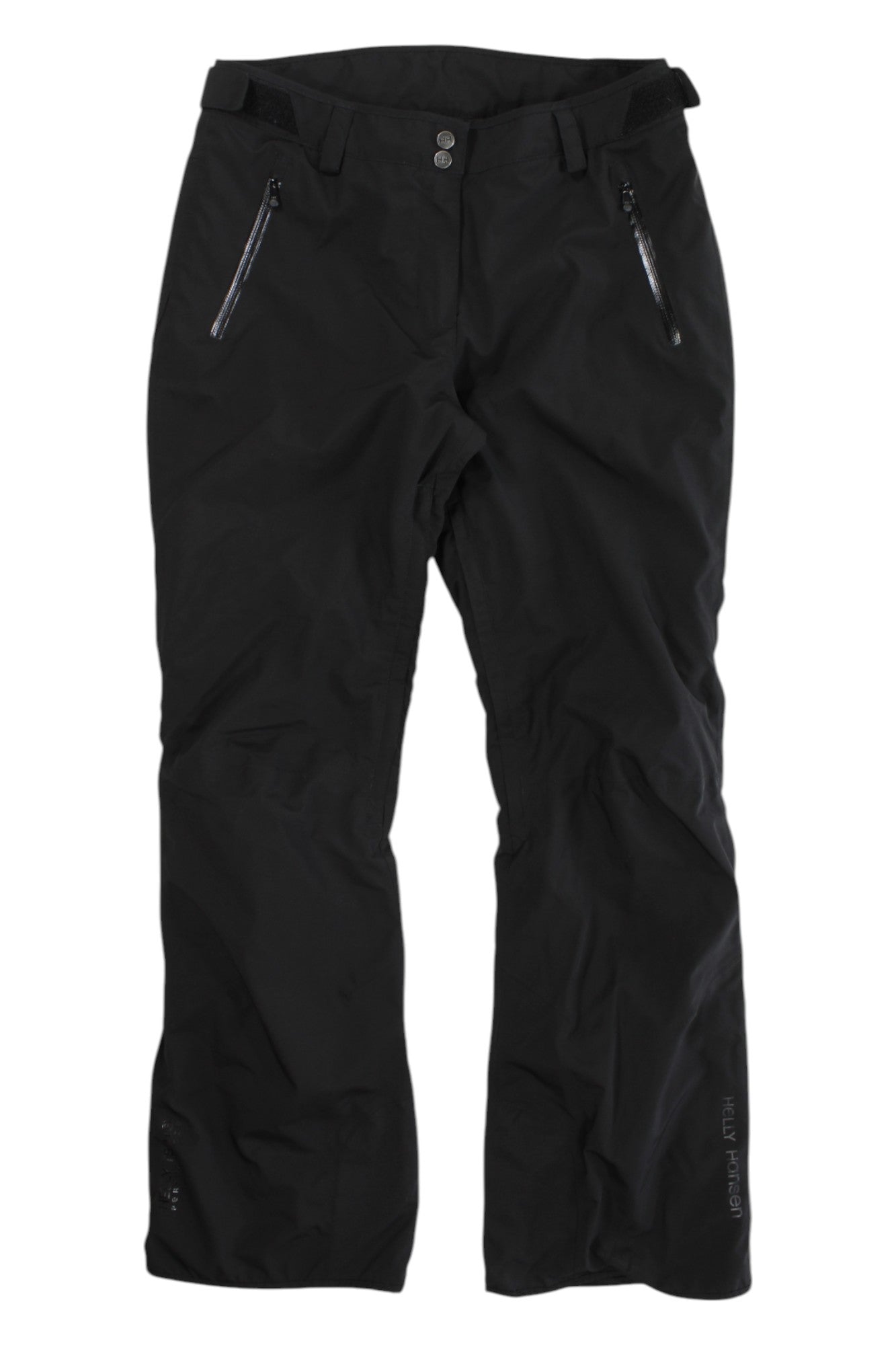 The Womens Treeline Pant, black PrimaLoft-insulated ski pants with two zippered front pockets, adjustable waistband, and straight legs, is shown laid flat on a white background.