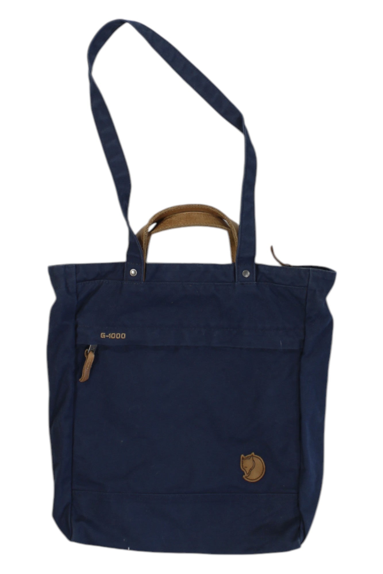 The Fjallraven Totepack No. 2, in navy blue with brown handles, shoulder straps, a front zippered pocket, and a round fox logo patch, offers versatile use as both a tote and backpack—ideal for everyday needs.