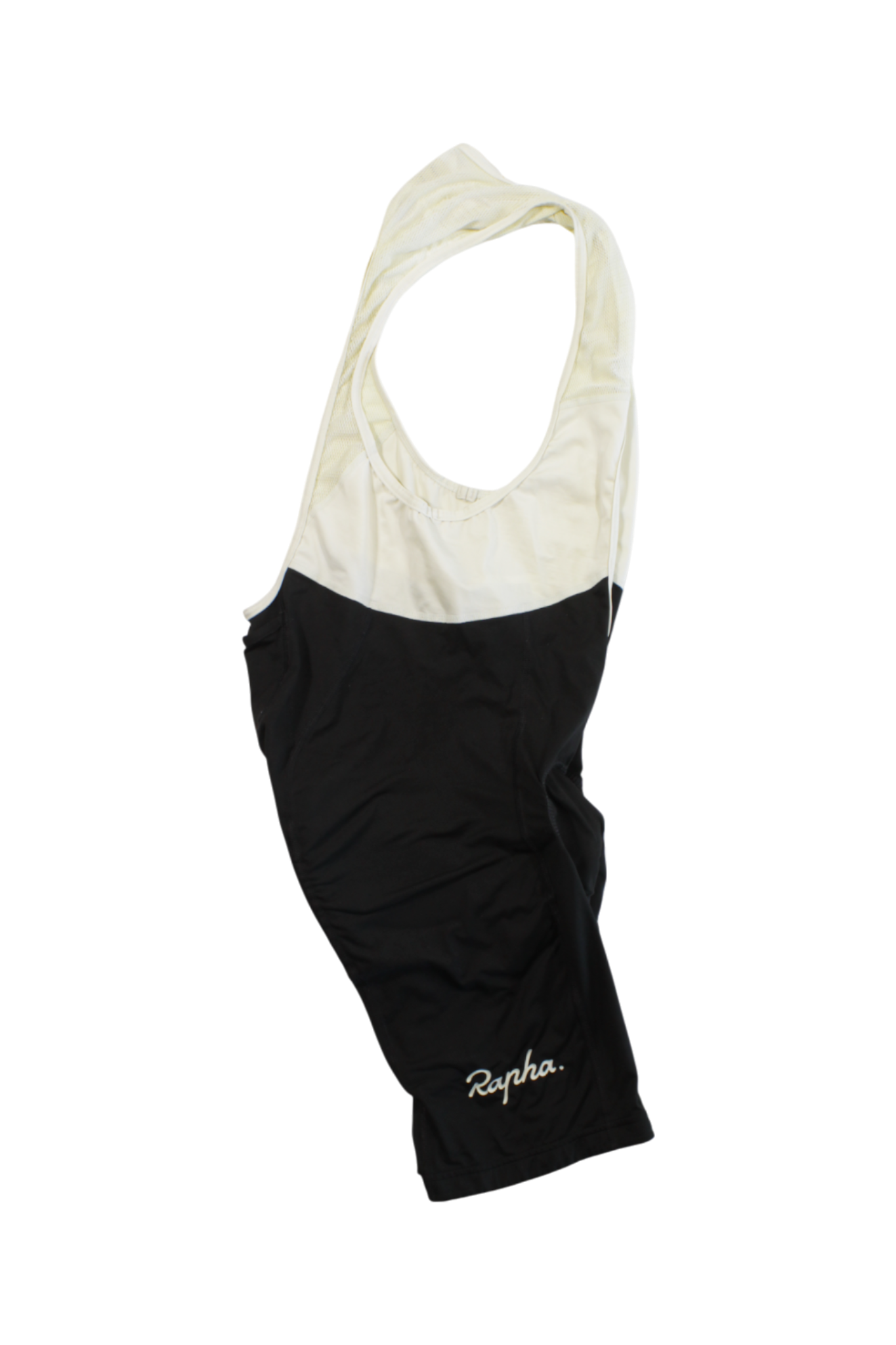Rapha Classic Bib Shorts in black and white, sleeveless and known for cycling performance, featuring "Rapha" script on the left leg, displayed flat on a white background.