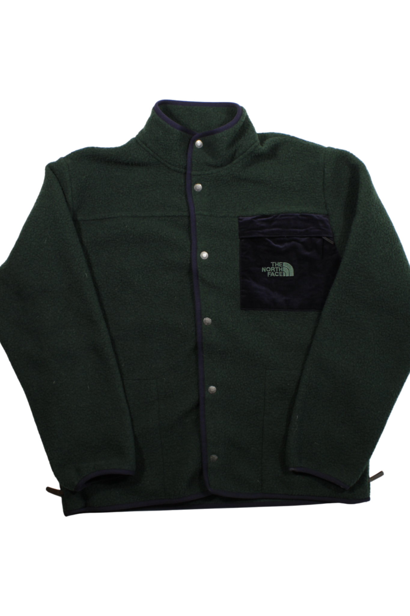 The North Face Mens Jasper Button Fleece is a dark green jacket with black trim, snap buttons, a black chest pocket with logo, long sleeves, and high collar, shown laid flat on a white background.