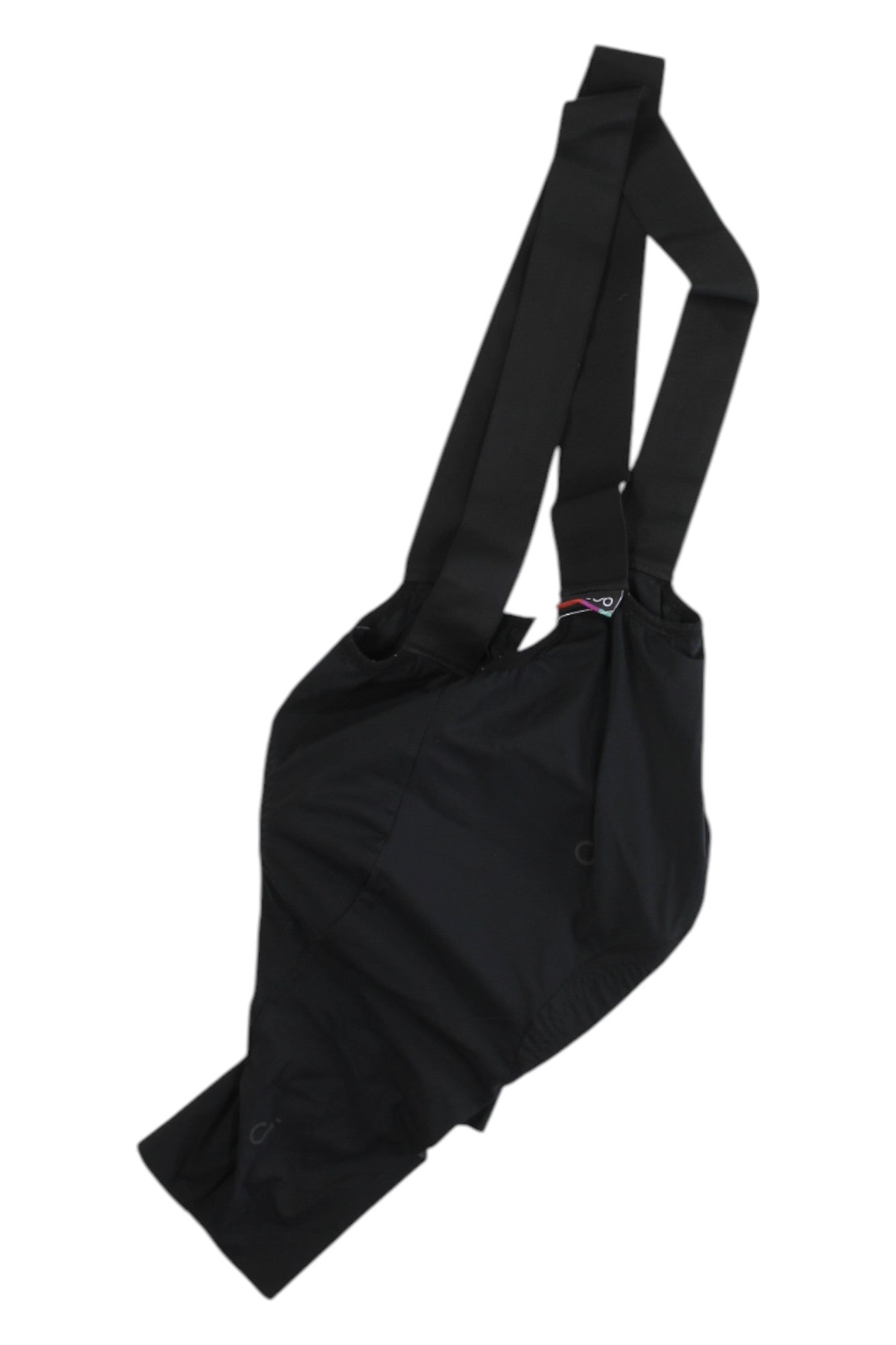 A black, asymmetrical crossbody bag with two wide straps and lightweight fabric—ideal for carrying essentials while cycling in your Velocio Mens Signature Bib Short. Shown on a white background.