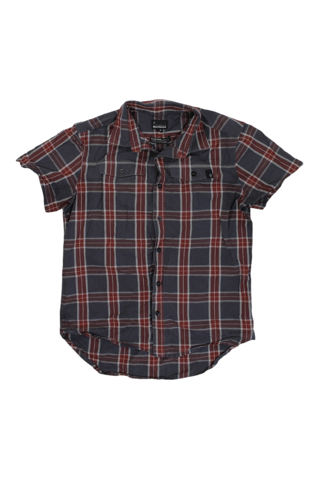The Black Diamond Mens Button Up Short Sleeve Top features a black, gray, red, and white plaid pattern, two chest pockets, a curved hem, and is made from abrasion-resistant organic cotton for comfort and durability.