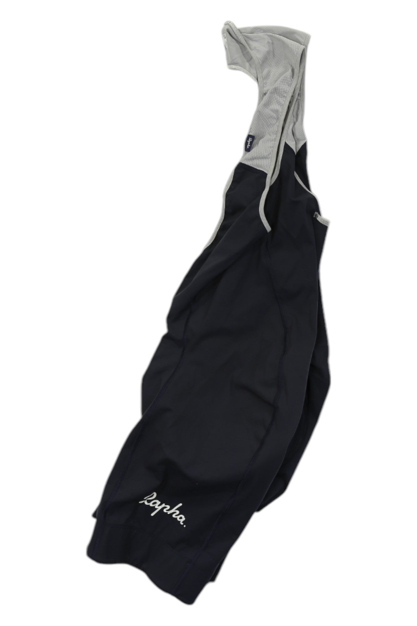 Rapha Classic Bib Shorts—a premium black cycling short with white mesh straps and "Rapha" in white on one leg—are laid flat on a white background.