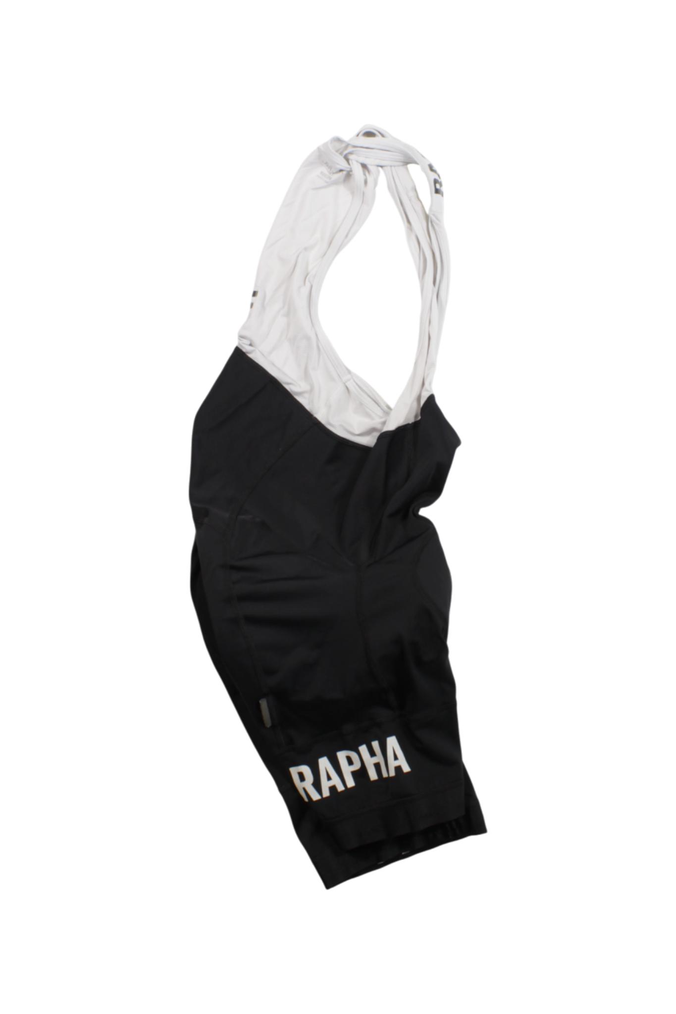 The Rapha Classic Bib Shorts, in black and white with white shoulder straps and the RAPHA logo on the left leg, are premium cycling shorts engineered for top performance, shown here on a plain white background.