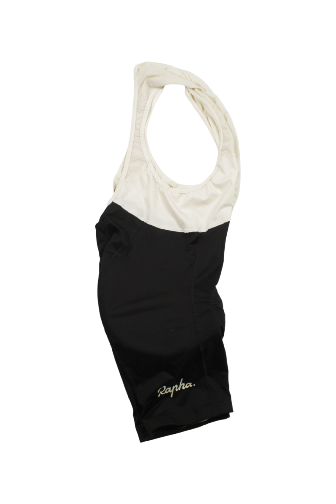 The Rapha Classic Bib Shorts in black and white feature gold embroidered branding on the left leg, laid flat on a white background—ideal for cyclists seeking premium comfort and performance.
