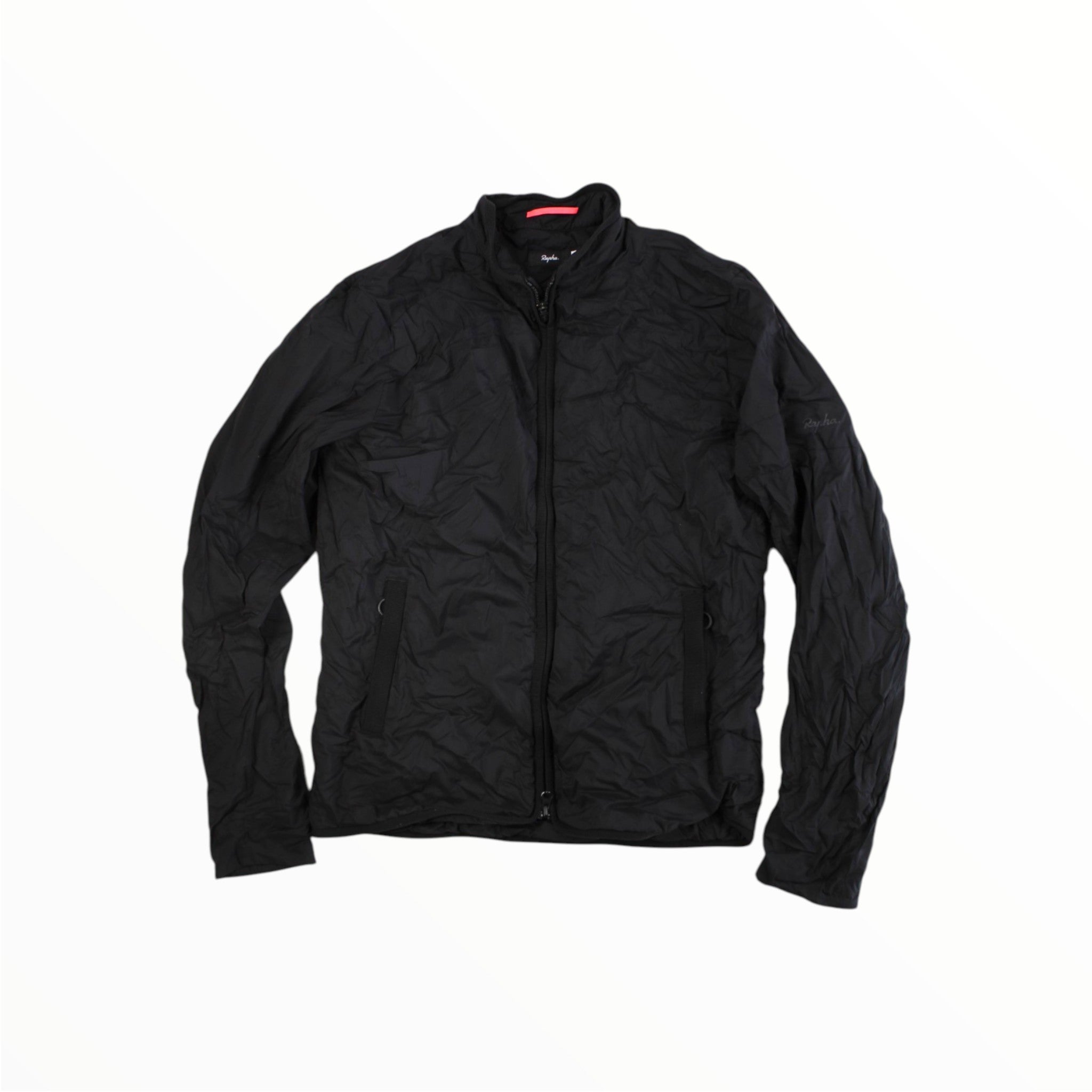 The Rapha Insulated Transfer Jacket by Rapha is a black, long-sleeve zip-up cycling jacket featuring two side pockets and a subtly wrinkled texture, shown laid flat on a white background—perfect for cool-weather rides and celebrated for its versatile design.