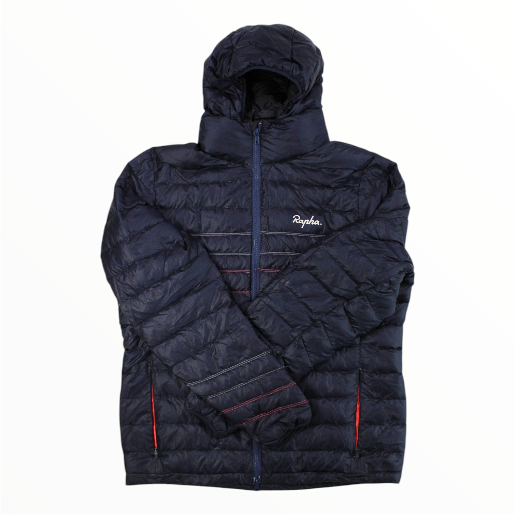 A Rapha Explore Down Jacket in navy blue, featuring a hood, front zipper, and the Rapha logo on the left chest. This versatile cycling down jacket is insulated and packable, with horizontal stitching and red-accented zipper pockets for both style and performance.