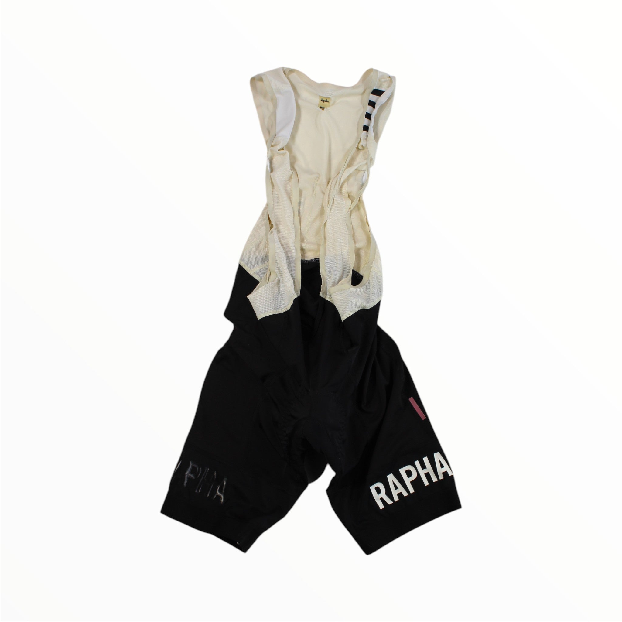 Men's cycling bib shorts with cream upper and black lower, Rapha logo on right leg