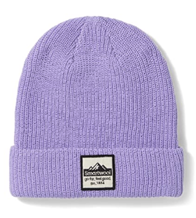 The Smartwool Patch Beanie is a lavender knit winter hat with a folded brim and a rectangular patch showcasing the Smartwool logo, mountain graphic, and "go far. feel good." slogan. Made from soft Merino wool for cozy warmth.
