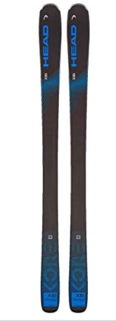 A pair of Head Kore X 85 Skis '23 in black and blue stand upright side by side, showcasing the HEAD logo and sleek freeride design elements near the tips and tails.