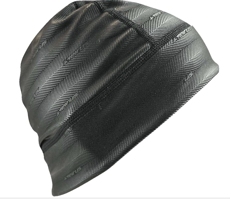 The Seirus Heatwave Skull Liner is a black beanie with a subtle herringbone pattern and vertical front seam, made from smooth, stretchy material with heat-retention tech—perfect lightweight headwear for outdoor or athletic activities.