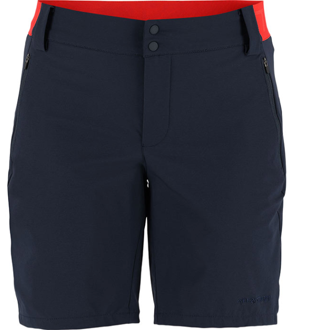 The Kari Traa Sanne Outdoor Shorts 8in in navy blue feature a red waistband, front zipper with double button closure, and zippered side pockets. Ideal as women's outdoor or hiking shorts. Displayed from the front on a plain background.