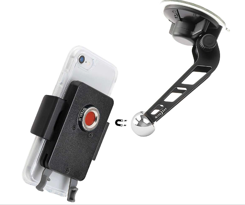 A smartphone is mounted on a Nite Ize Steelie Squeeze Windshield Kit, a black magnetic smartphone mount with a suction cup base and adjustable arm for dashboard or windshield use, offering a secure magnetic hold for hands-free driving.