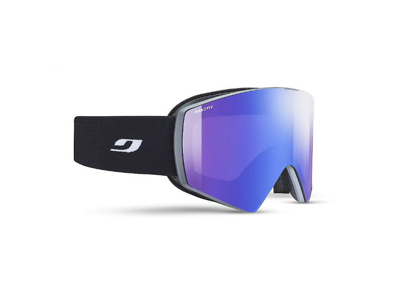 The Julbo Razor Edge Goggle features a black strap with a white logo and a large mirrored blue lens, ideal for skiing or snowboarding. It includes an anti-fog coating to ensure clear vision during outdoor activities.