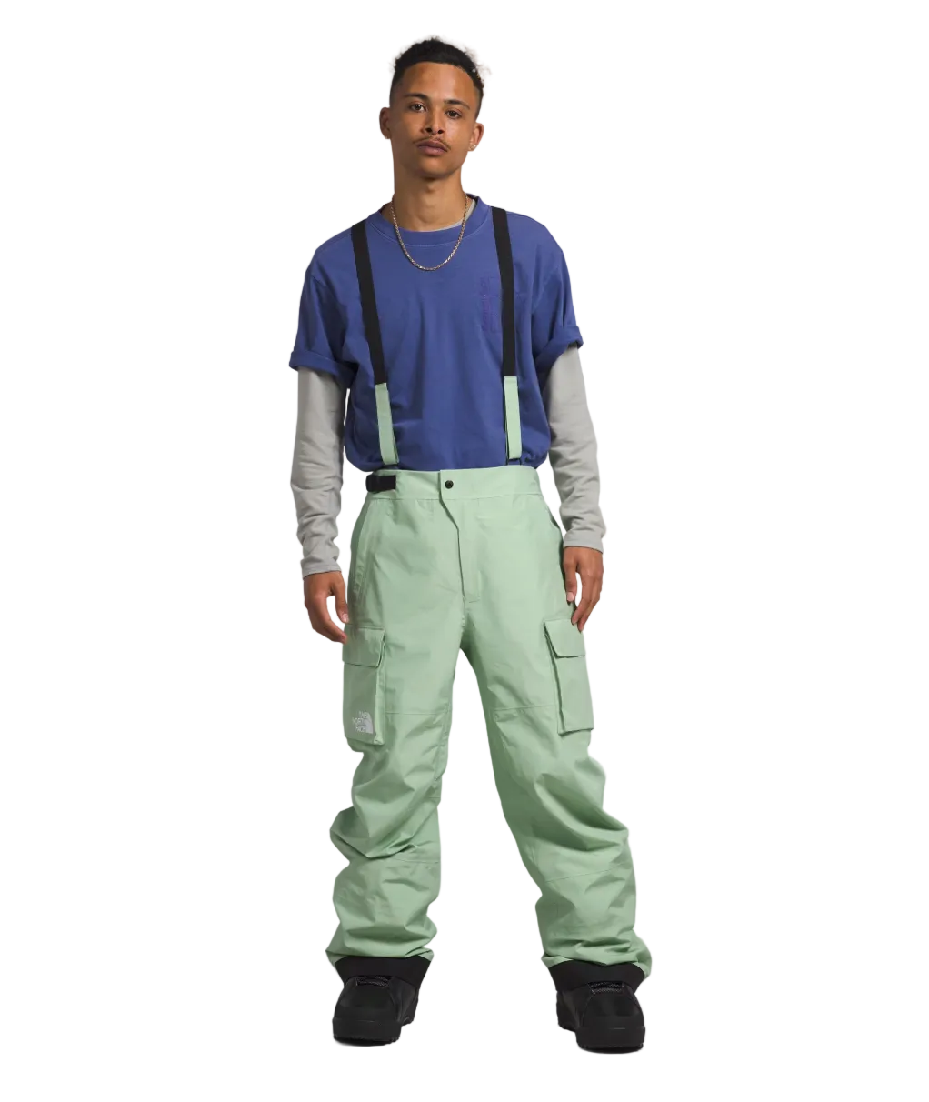 Men's waterproof cargo pants in light sage green with adjustable side straps and pockets