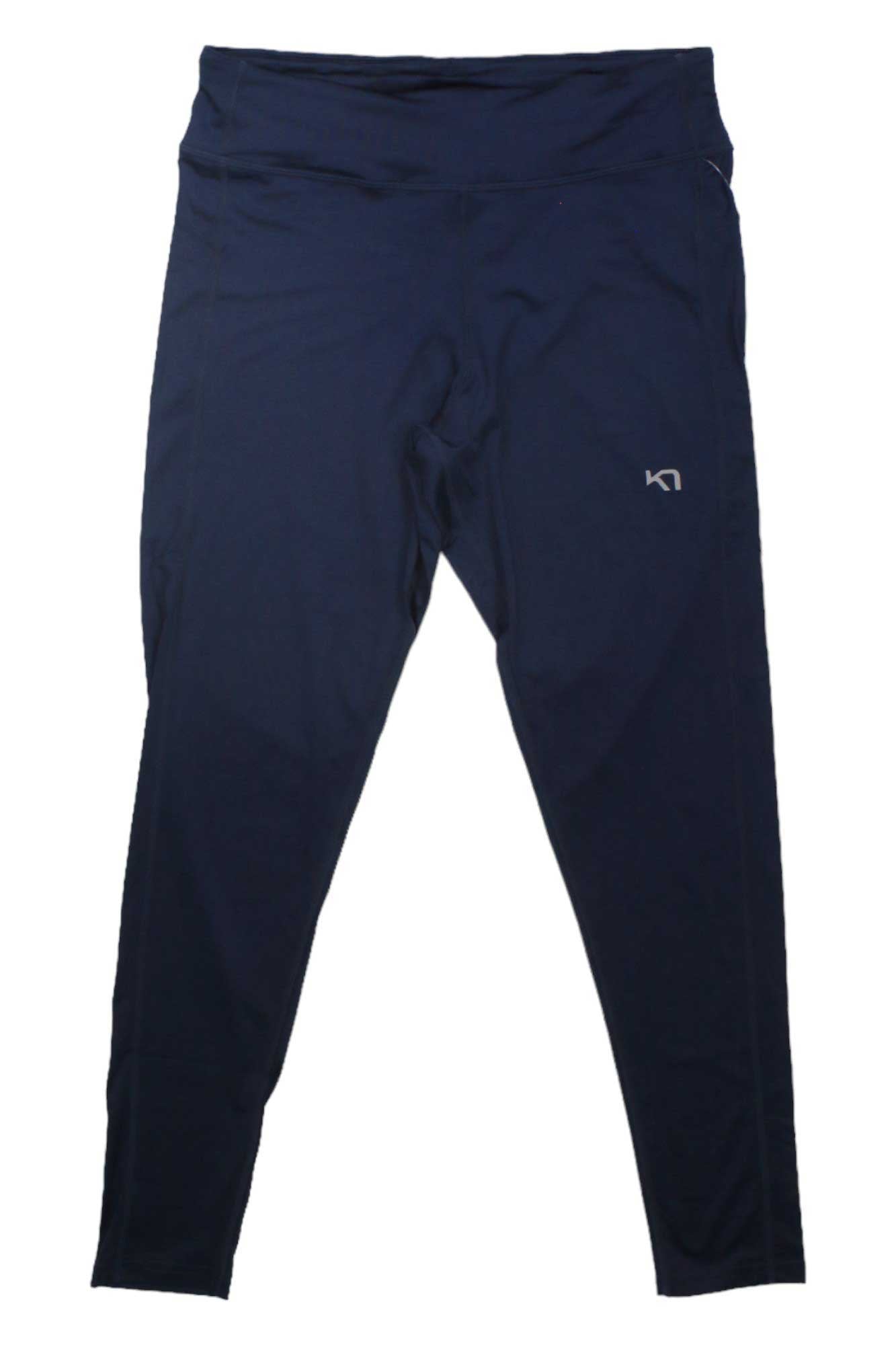 The Kari Traa Women's Nora 2.0 Tight in black features quick-drying fabric and a small white logo on the upper left thigh, displayed flat on a white background.