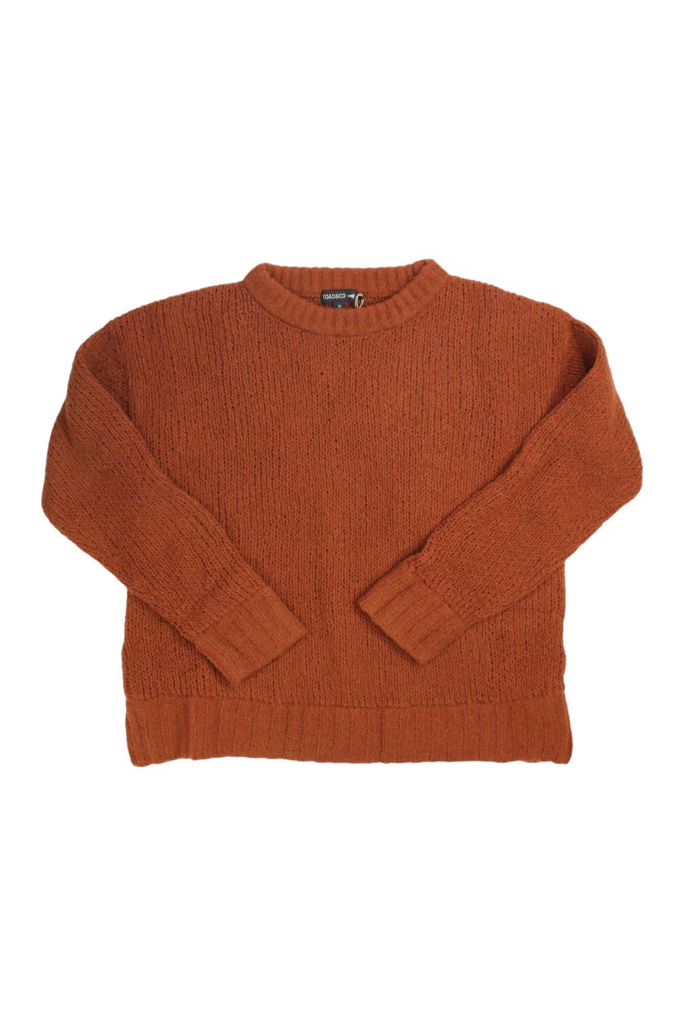 The Toad & Co Womens Cotati Dolman Sweater in rust, with long sleeves, a crew neckline, and ribbed cuffs and hem, is shown flat on white—an ideal wool sweater for women and perfect for travel.