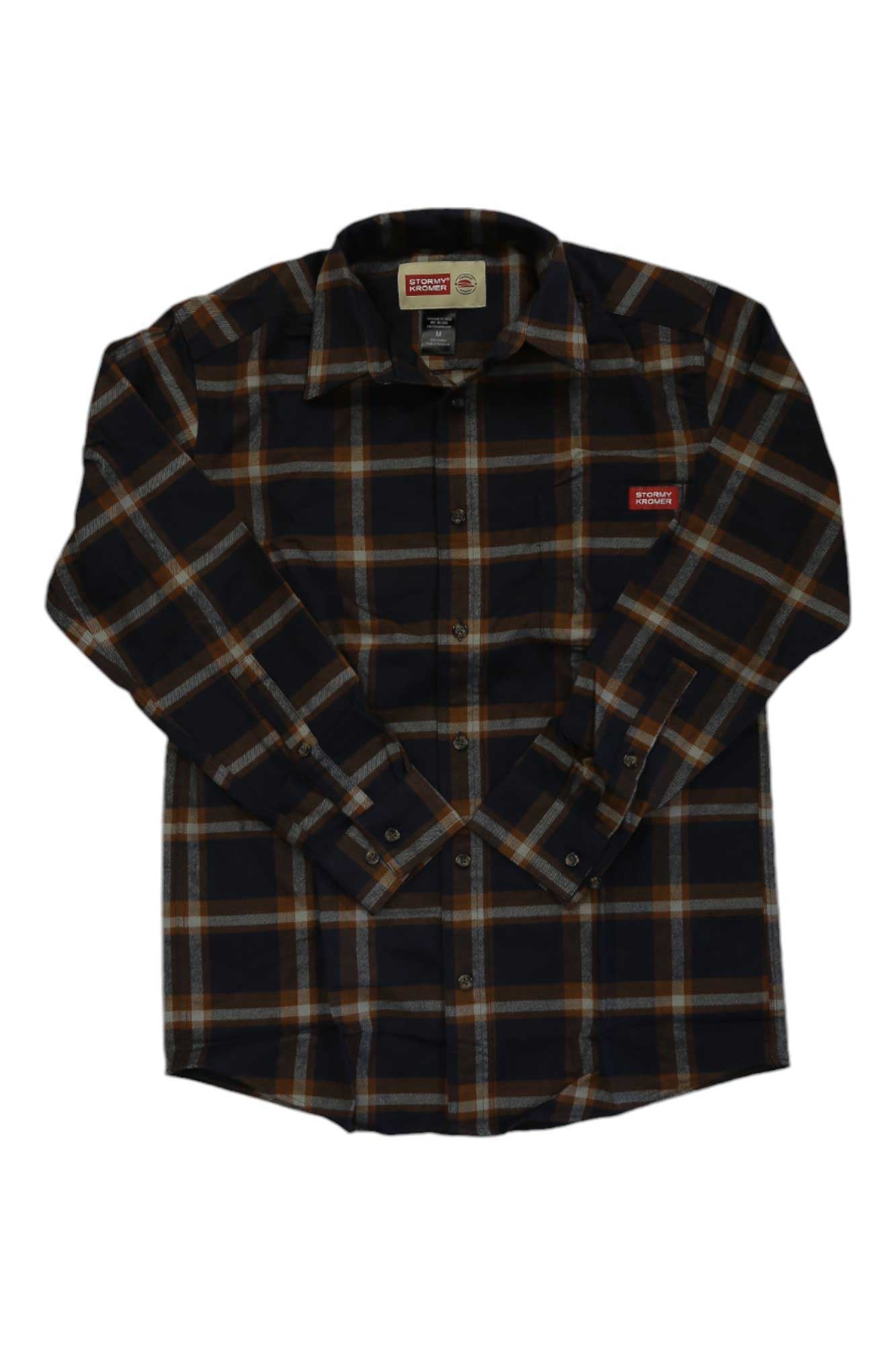 The Stormy Kromer Mens The Flannel Shirt is a soft cotton flannel in black, brown, and white plaid. It features long sleeves, a button-up front, and a small red logo patch on the left chest. Shown laid flat on a white background.