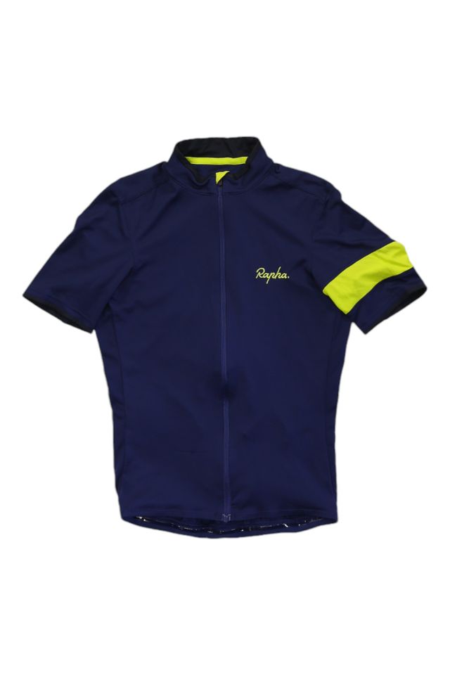 The Rapha Mens Super Lightweight Jersey is a navy short-sleeve cycling jersey with a front zipper, high collar, and yellow stripe on the left sleeve. "Rapha" appears in white on the chest.
