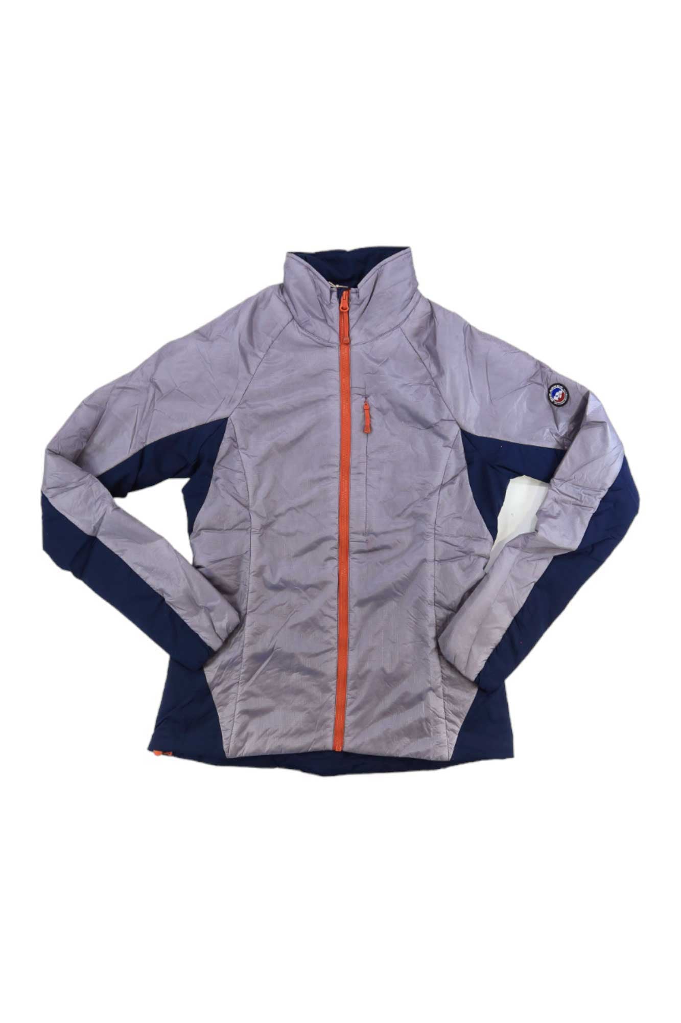 The Big Agnes Womens Crystal Jacket, in light gray and navy blue with Primaloft Insulation, features an orange zipper, high collar, and a circular patch on the left sleeve. It is displayed laid flat on a white background.
