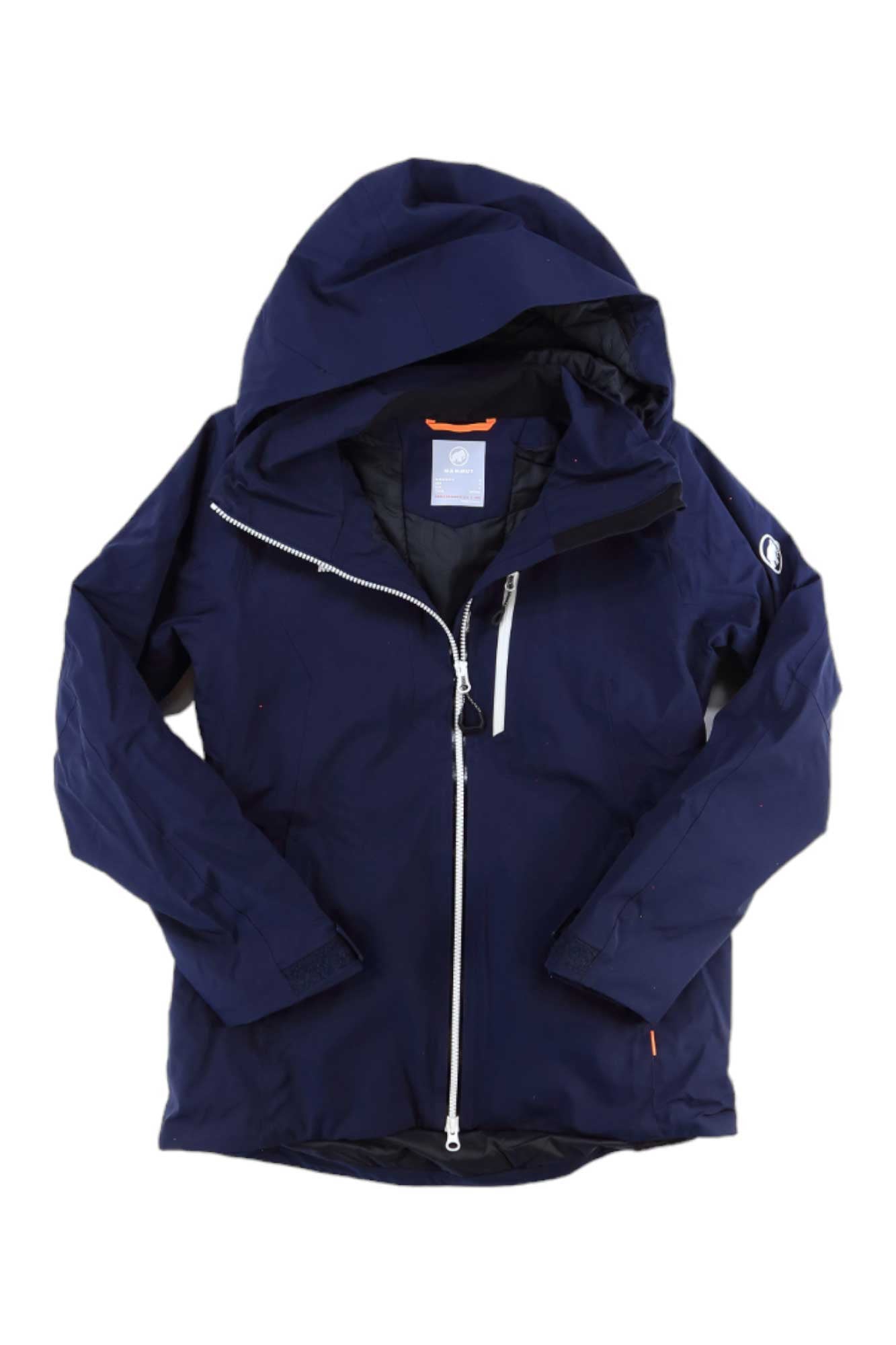 The Mammut Womens Stoney HS Thermo Jacket is a navy blue insulated ski jacket with a hood, front zipper, long sleeves, and a small white logo on the left sleeve, shown laid flat on a white background.
