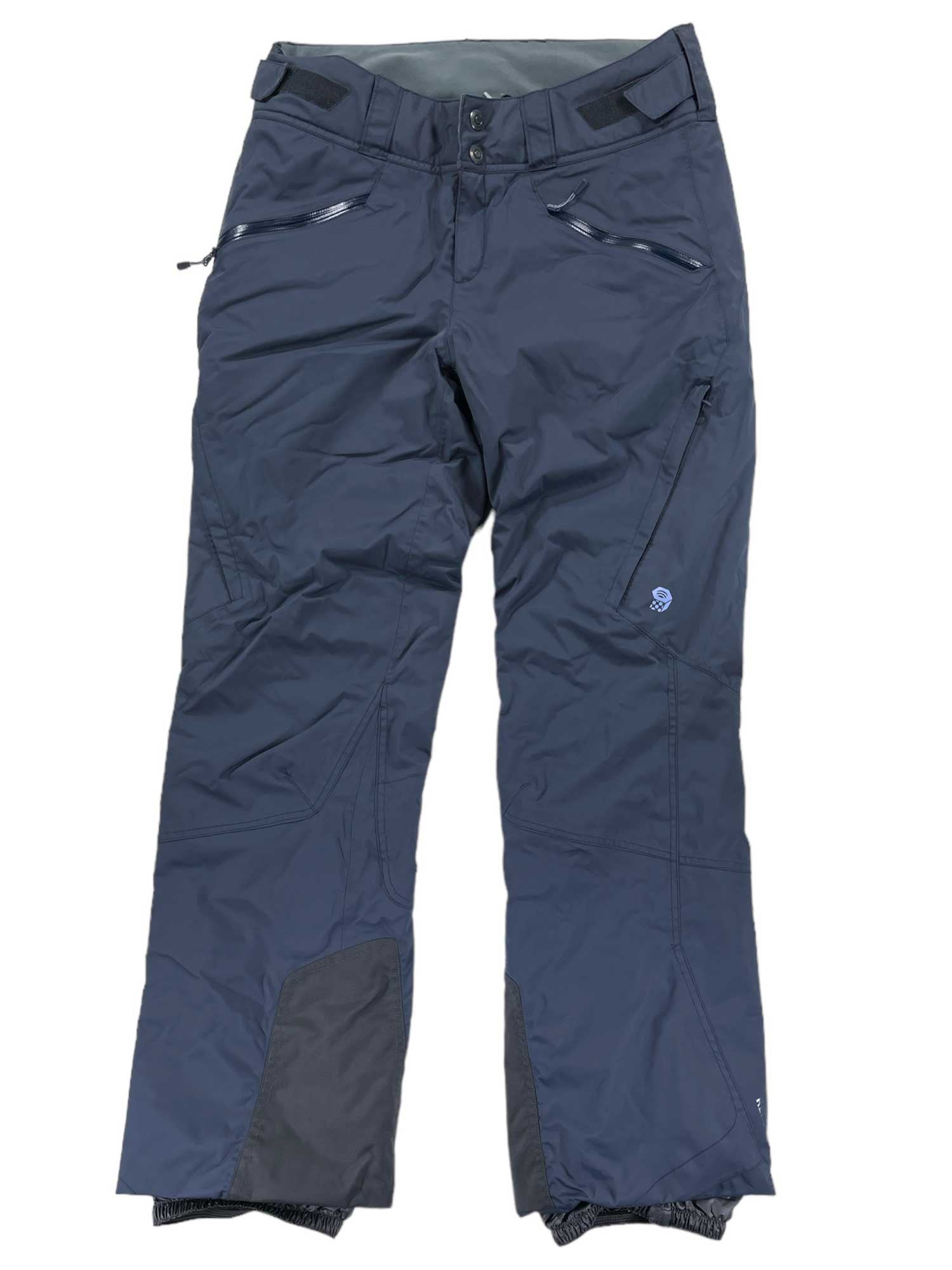The Women's Link Insulated Pants are dark blue, waterproof, and breathable, featuring zippered pockets, reinforced knees, and adjustable waist tabs—ideal for hiking or skiing.
