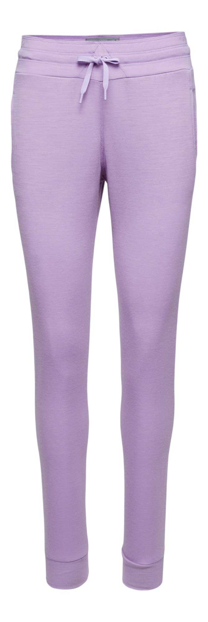 Icebreaker Womens Crush Pants in lavender, featuring a drawstring waist, side pockets, and ribbed ankle cuffs. Inspired by women's activewear, these jogger sweatpants offer a fitted, casual style, shown on a white background.