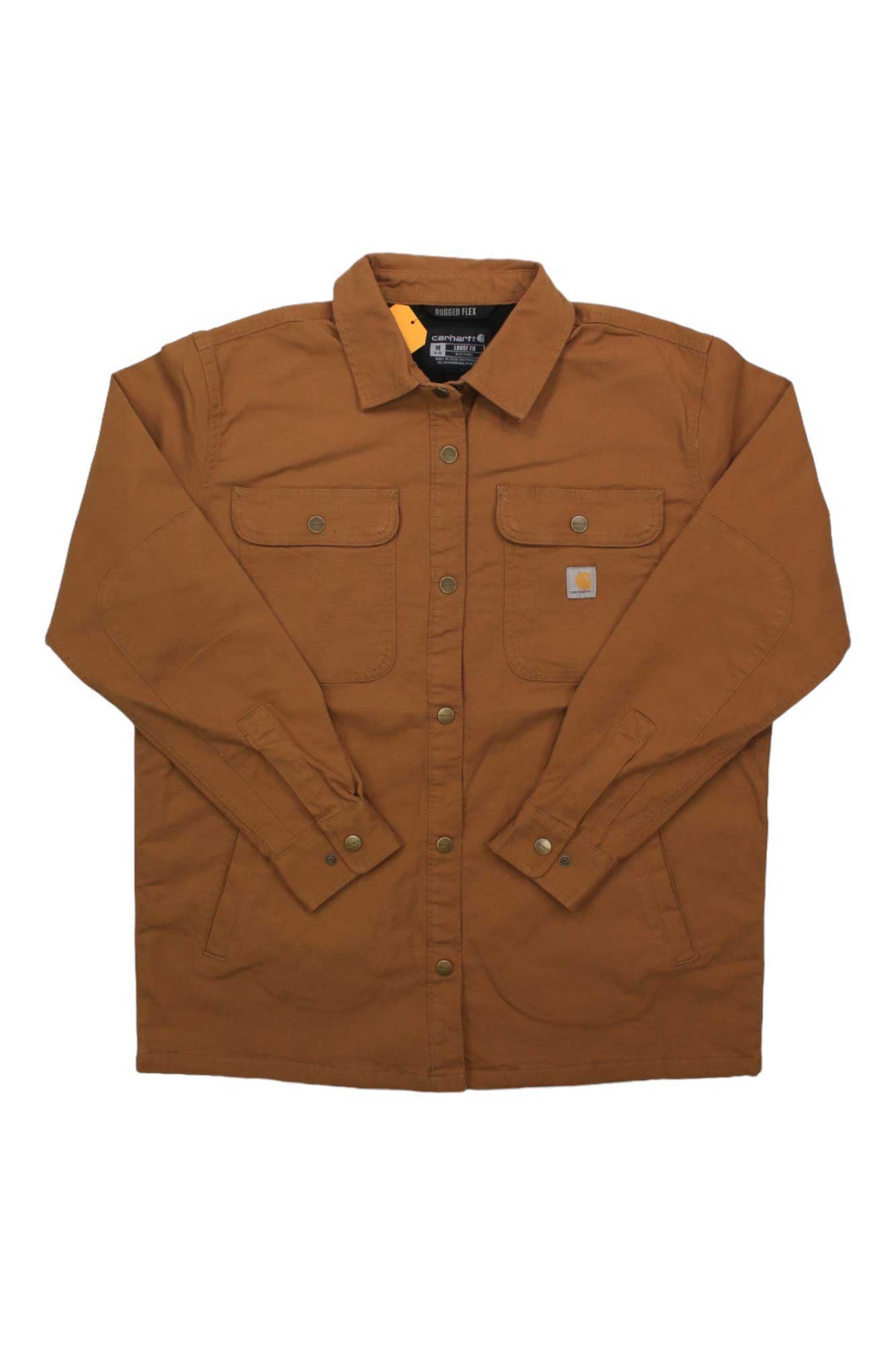 A Carhartt Womens Rugged Flex Loose Fit Canvas Fleece Lined Shirt Jacket in brown is laid flat on a white background, featuring two chest flap pockets with buttons and a logo patch on the left pocket.