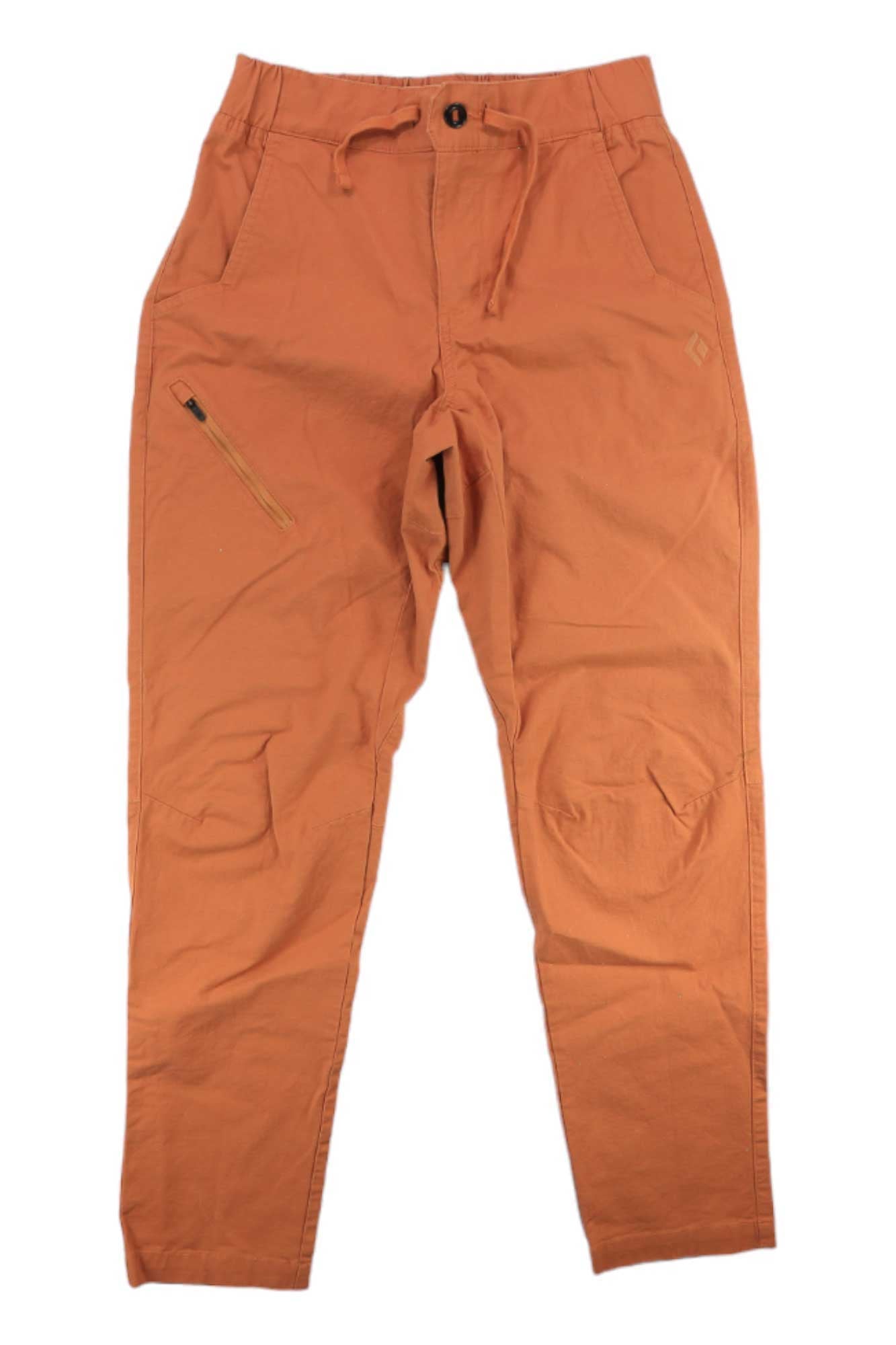 A pair of orange-brown Black Diamond Men's Rocklock Climb Pants, made from organic cotton with an elastic waistband, drawstring, right thigh front zipper pocket, and reinforced knees, is laid flat on a white background.