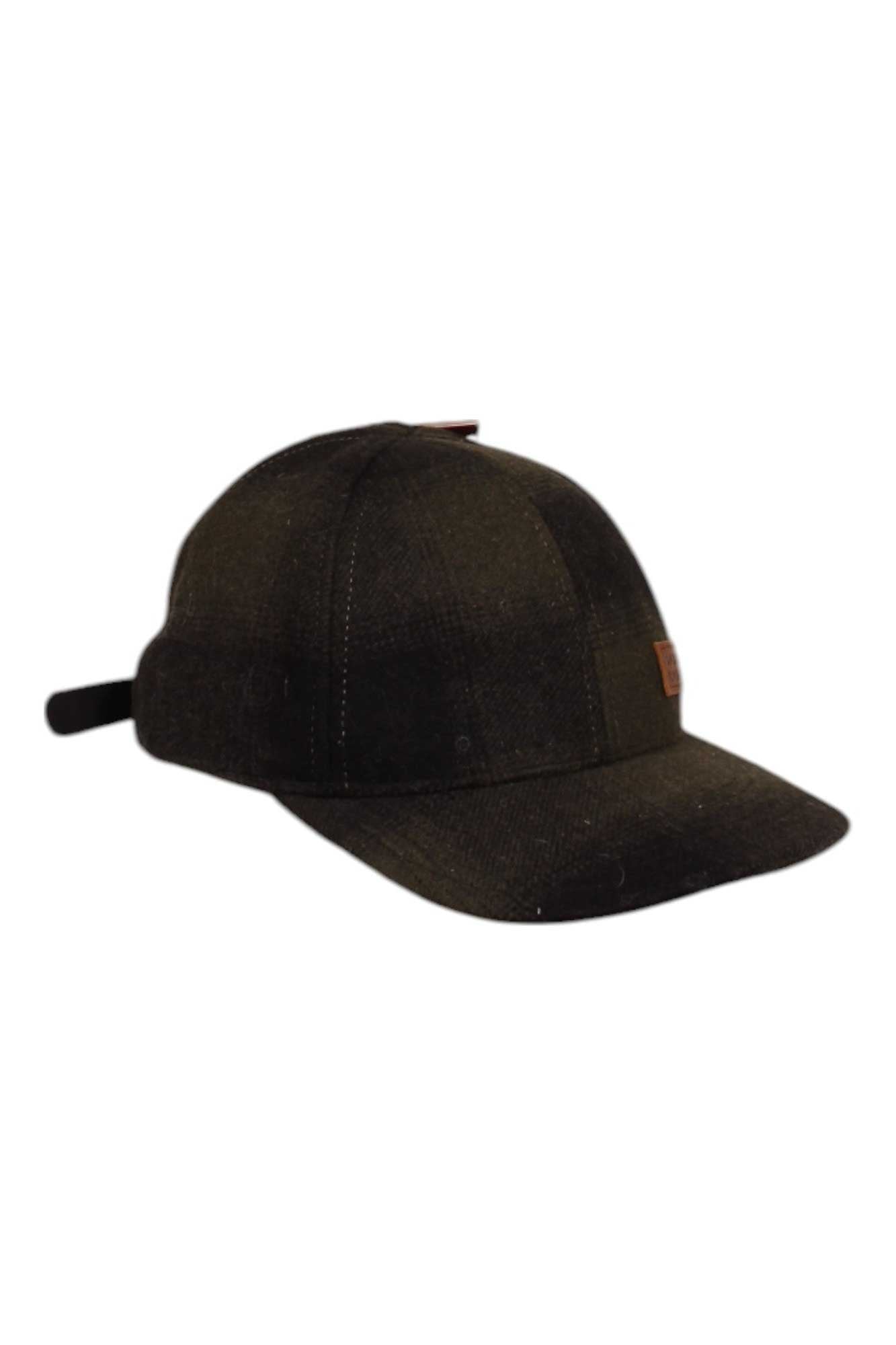 The Stormy Kromer The Adjustable Curveball Cap is a dark, moisture-wicking baseball cap with UV protection, a curved brim, and an adjustable strap at the back, shown on a white background.