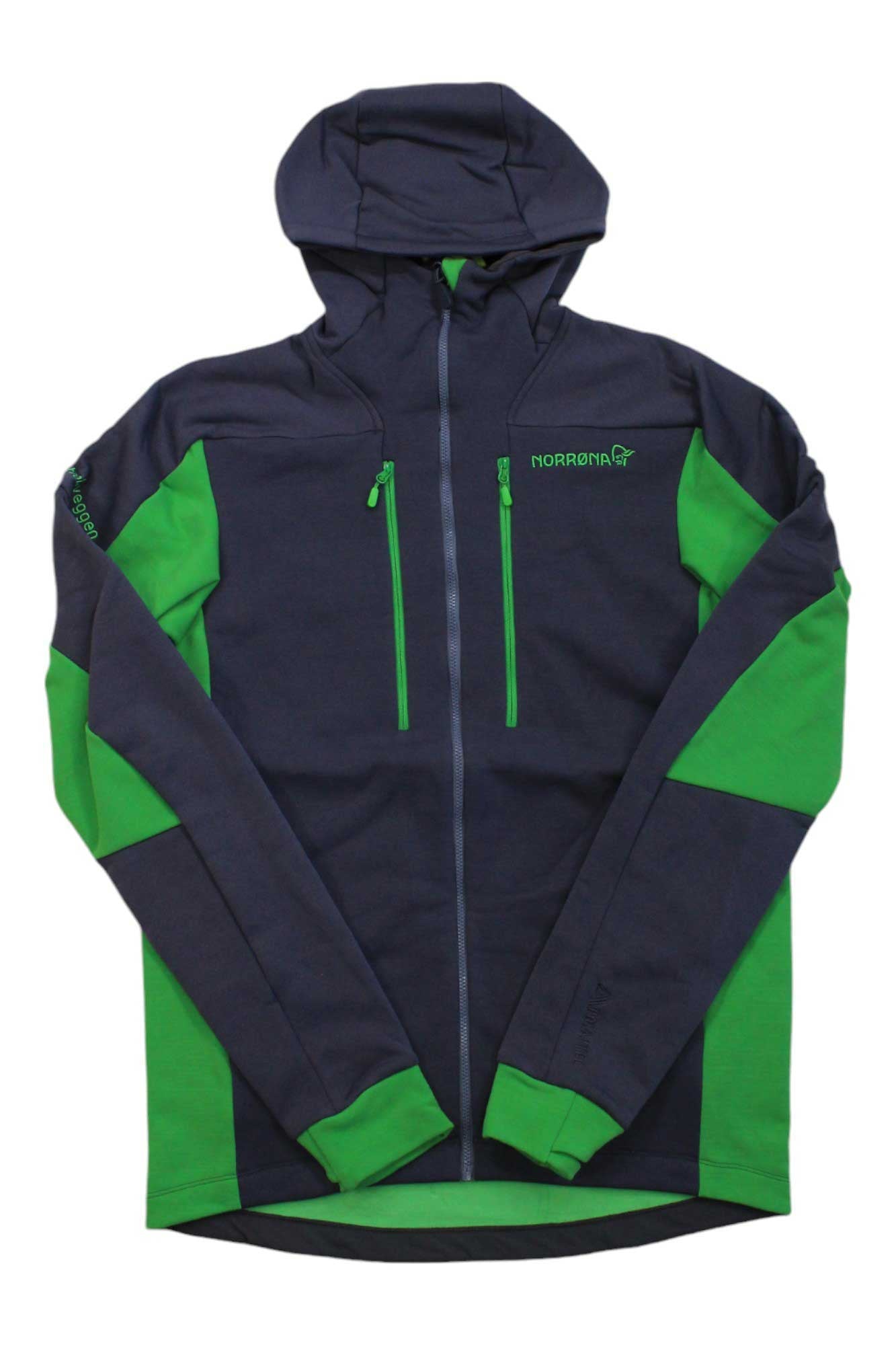 The Norrona Mens Trollveggen Powerstretch Pro Zip Hoodie is a dark blue and green hooded jacket with a front zipper, two chest pockets, green accents on the arms, sides, and cuffs, and Polartec Power Stretch Pro fabric for insulation.