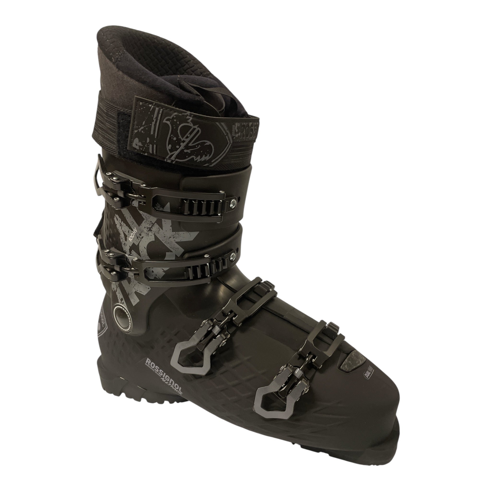 The Rossignol Alltrack 100 HV Ski Boots in black feature four adjustable buckles, a textured sole, a customizable liner, and side branding, displayed against a white background.