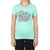 A woman wears the Moosejaw Womens Mint Mojito SS Tee, a sustainable organic cotton top in light green, featuring "Moose Jaw" in pink letters and colorful flowers—perfect for casual wear.