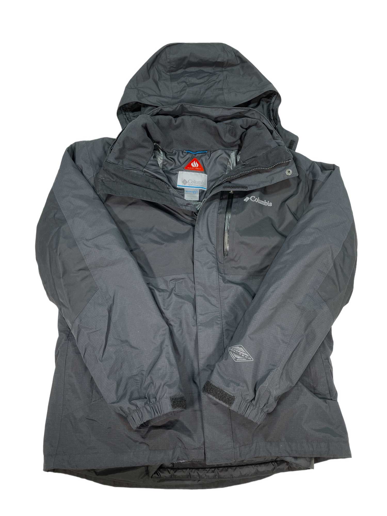 A dark gray Men's Rural Mountain II Interchange Jacket by Columbia with Omni-Heat, hood, zippered chest pocket, elastic cuffs, and visible brand logos is laid flat with sleeves crossed over the front.
