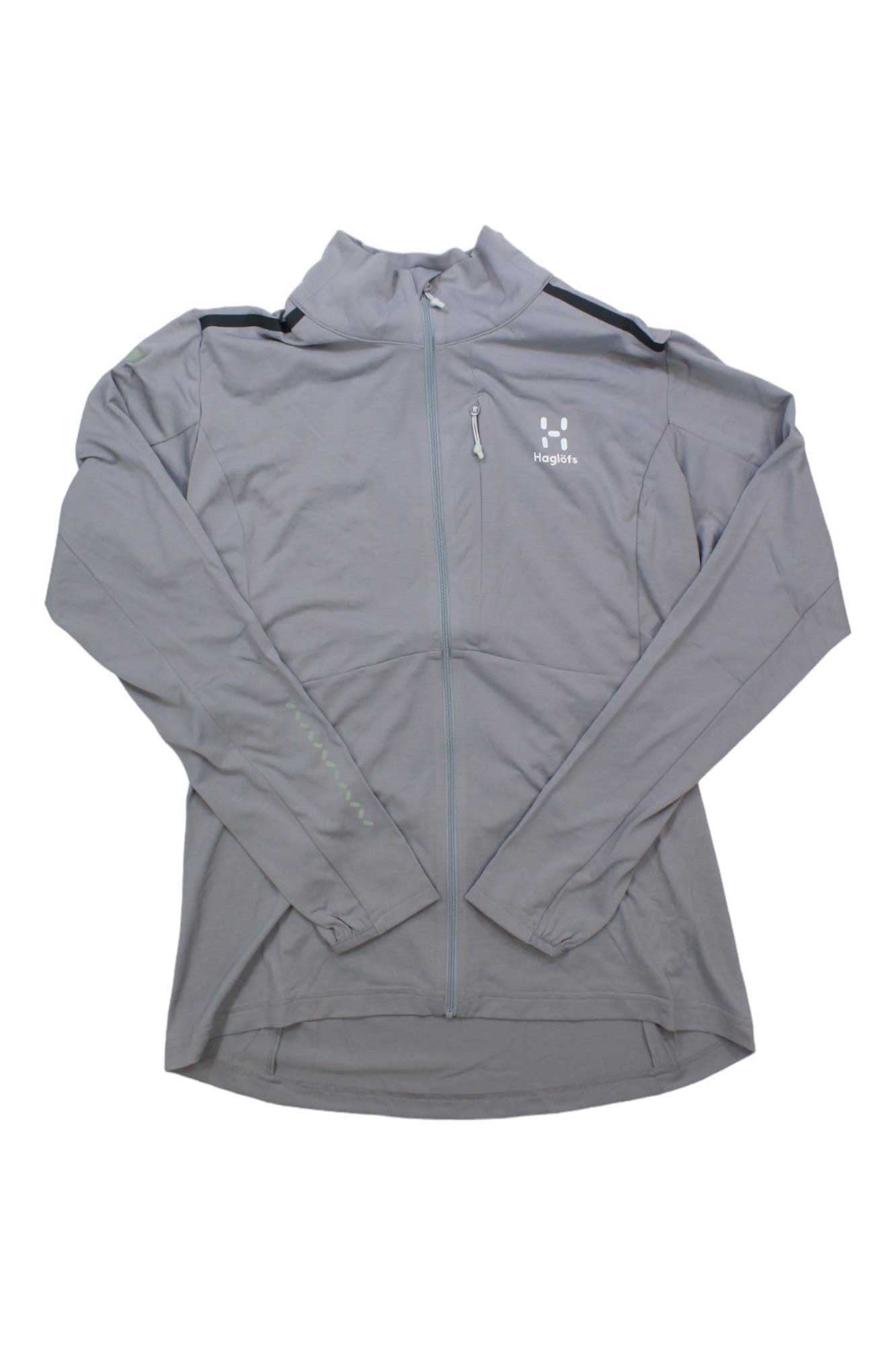 A Haglofs Women's L.I.M Strive Mid Jacket in light gray, lightweight with long sleeves, a high collar, and a zippered chest pocket, is laid flat on a white background.