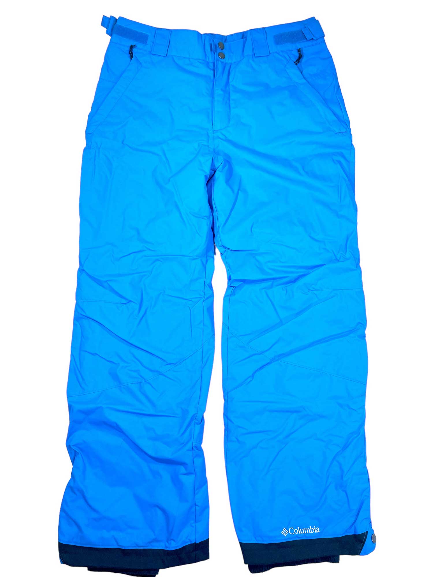 Arctic Trip Snow Pants in bright blue with waterproof fabric, front pockets, black cuff accents, built-in snow gaiters, belt loops, and button-zipper closure are shown laid flat on a white background.