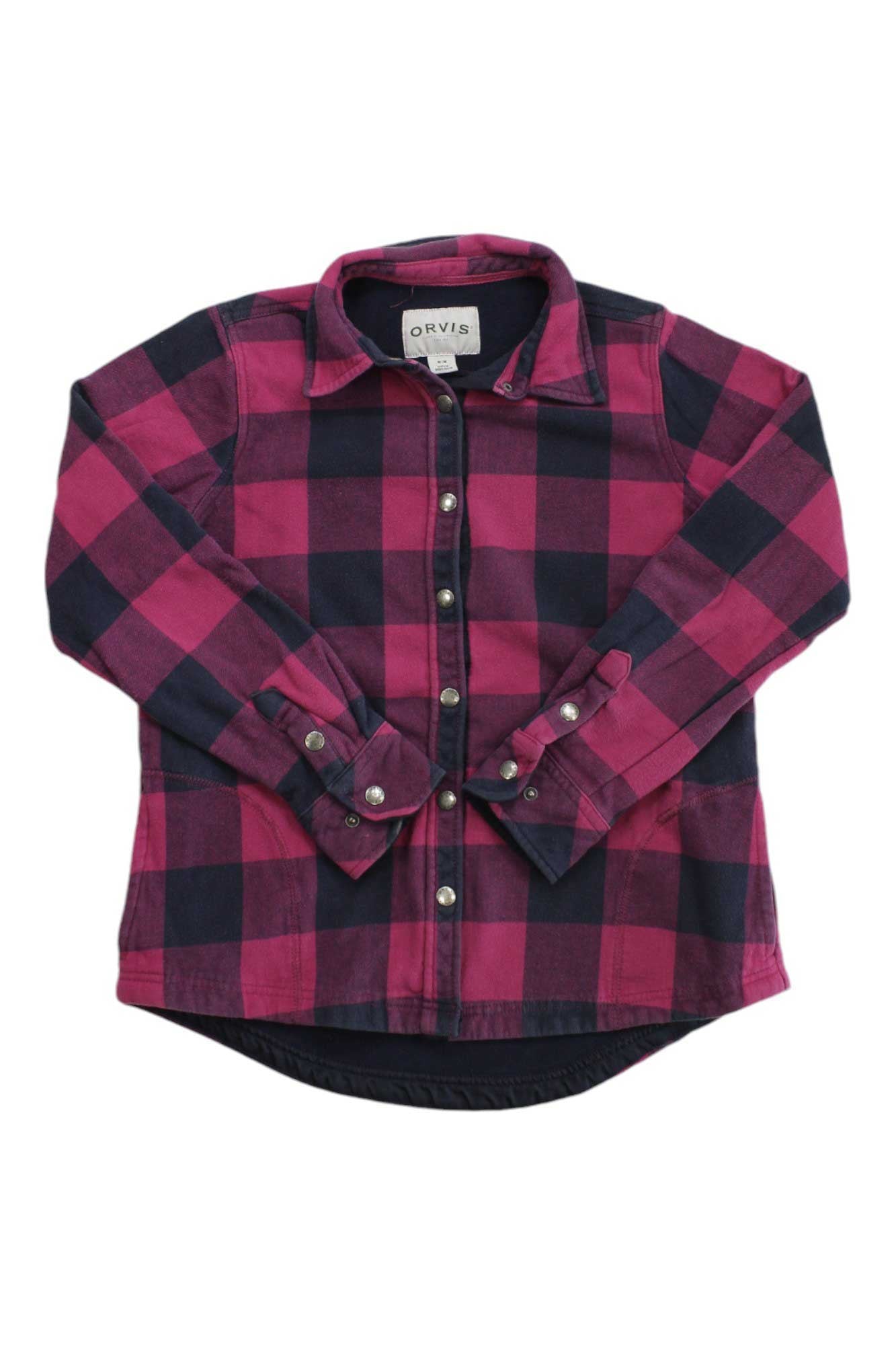 The Womens Fleece Lined Flannel Pinnacle Shirt Jacket features a red and black checkered pattern, front buttons, and a collar, styled flat with crossed sleeves for a cozy, classic look.