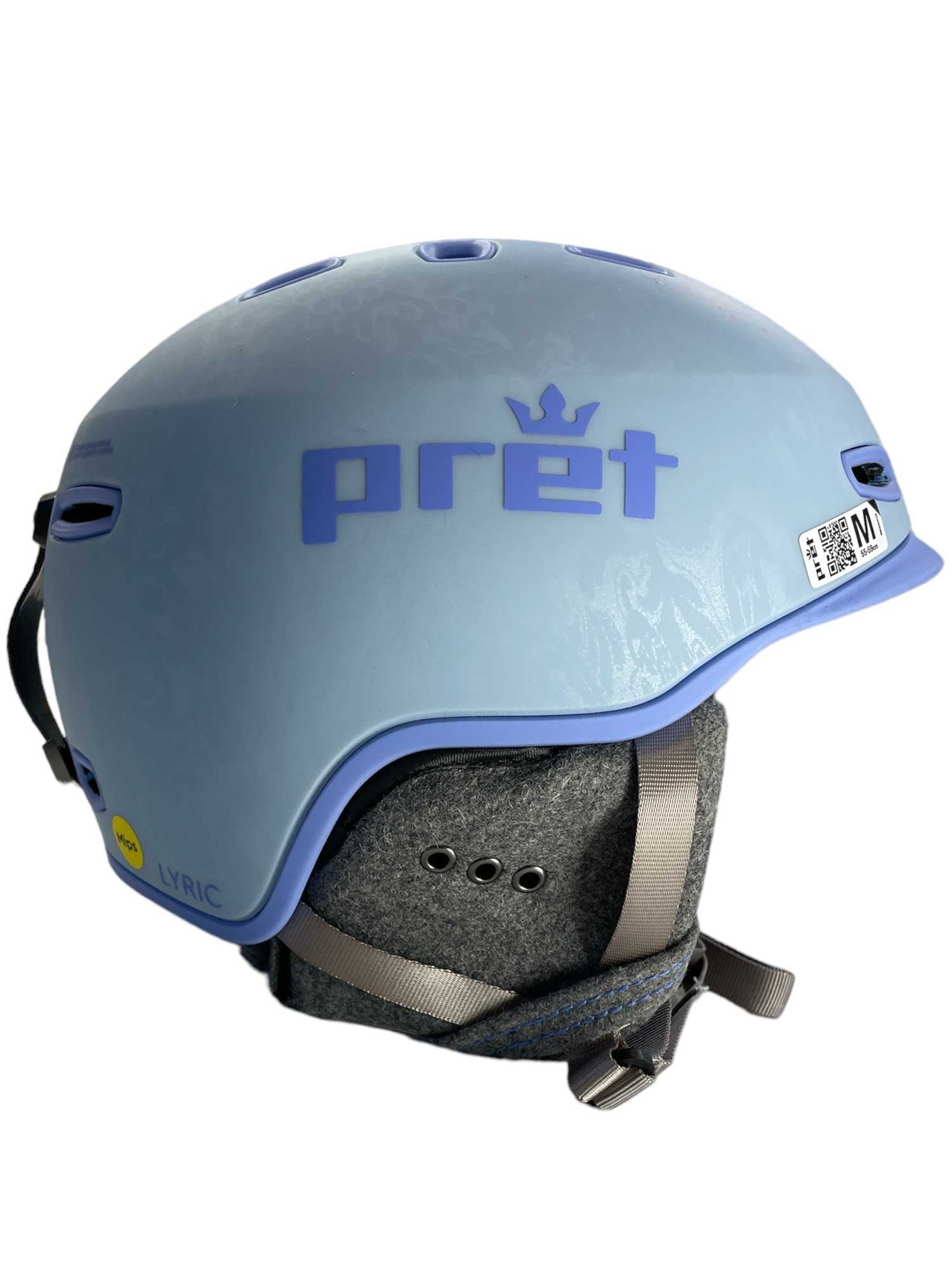 The Pret Womens Lyric X2 Ski Helmet in light blue features gray chin straps, ventilation holes, and a side Lyric label. This medium helmet has a soft padded interior and adjustable fit for comfortable skiing.